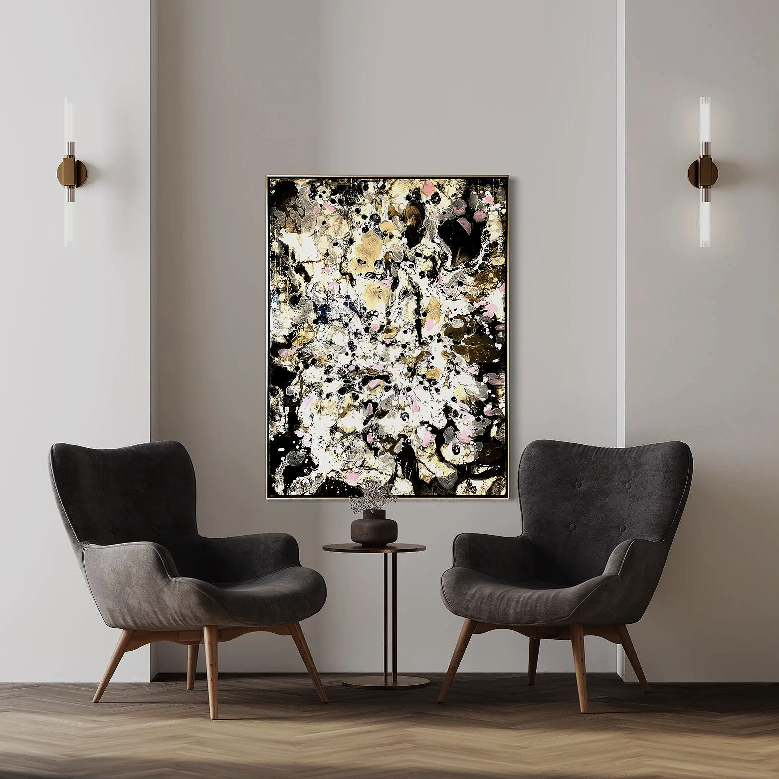 A modern sitting area with two gray upholstered chairs, a small round side table, an abstract painting on the wall, and two wall-mounted lights on either side of the painting.