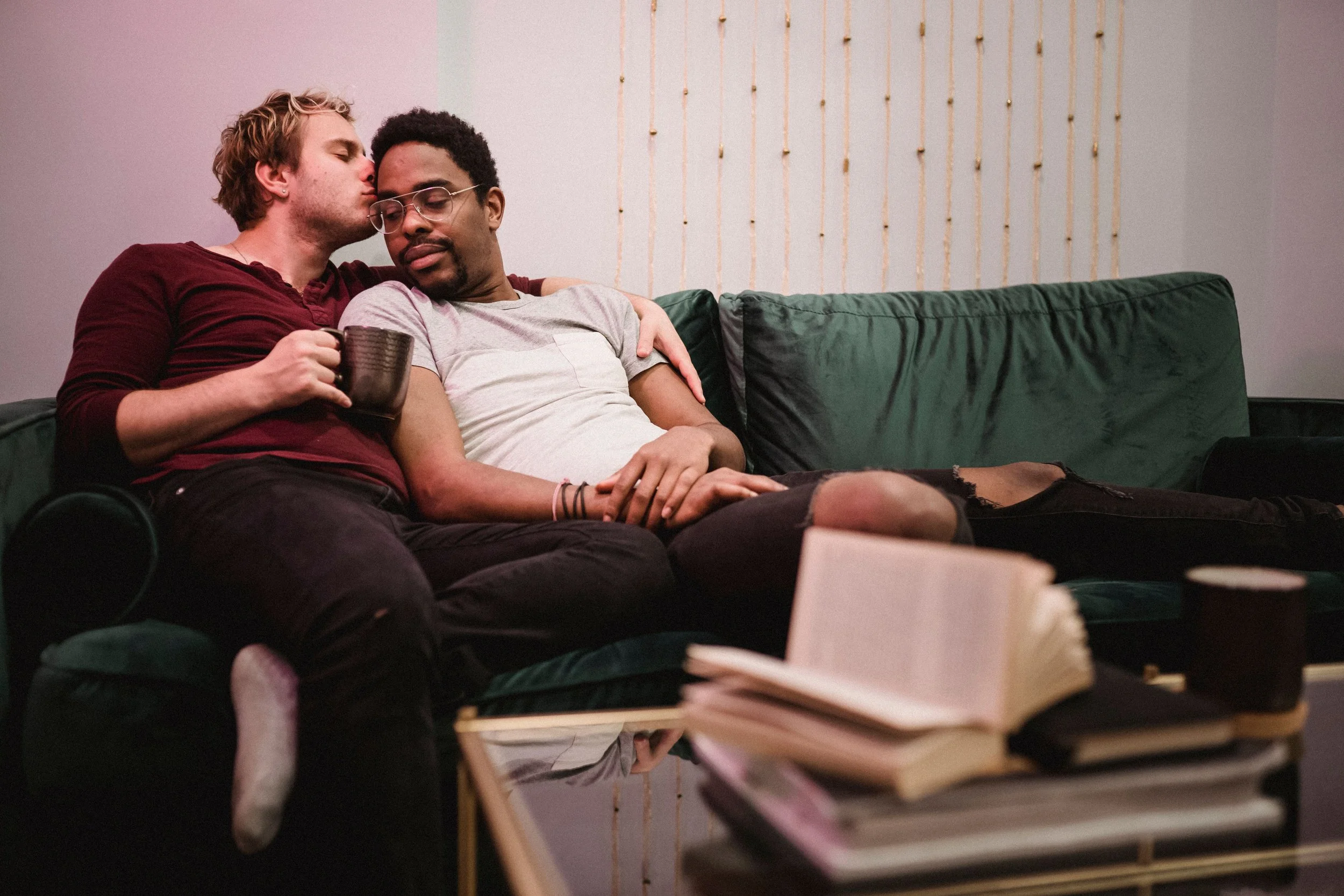 Two men comforting each other in a supportive and compassionate moment
