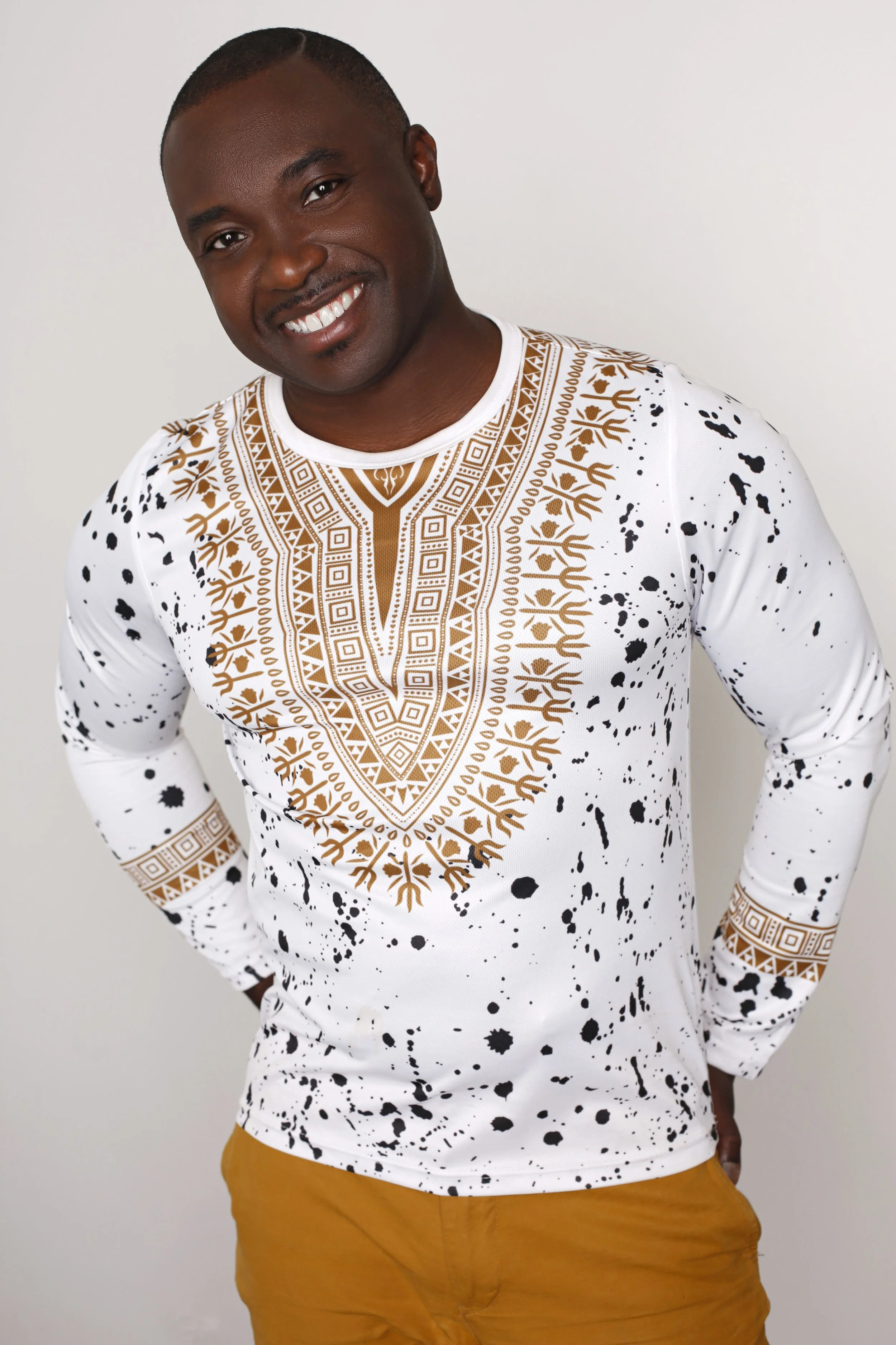 Smiling portrait of Trevor James, wellness and transformational coach helping individuals improve mental wellness, resilience, leadership, and personal development.