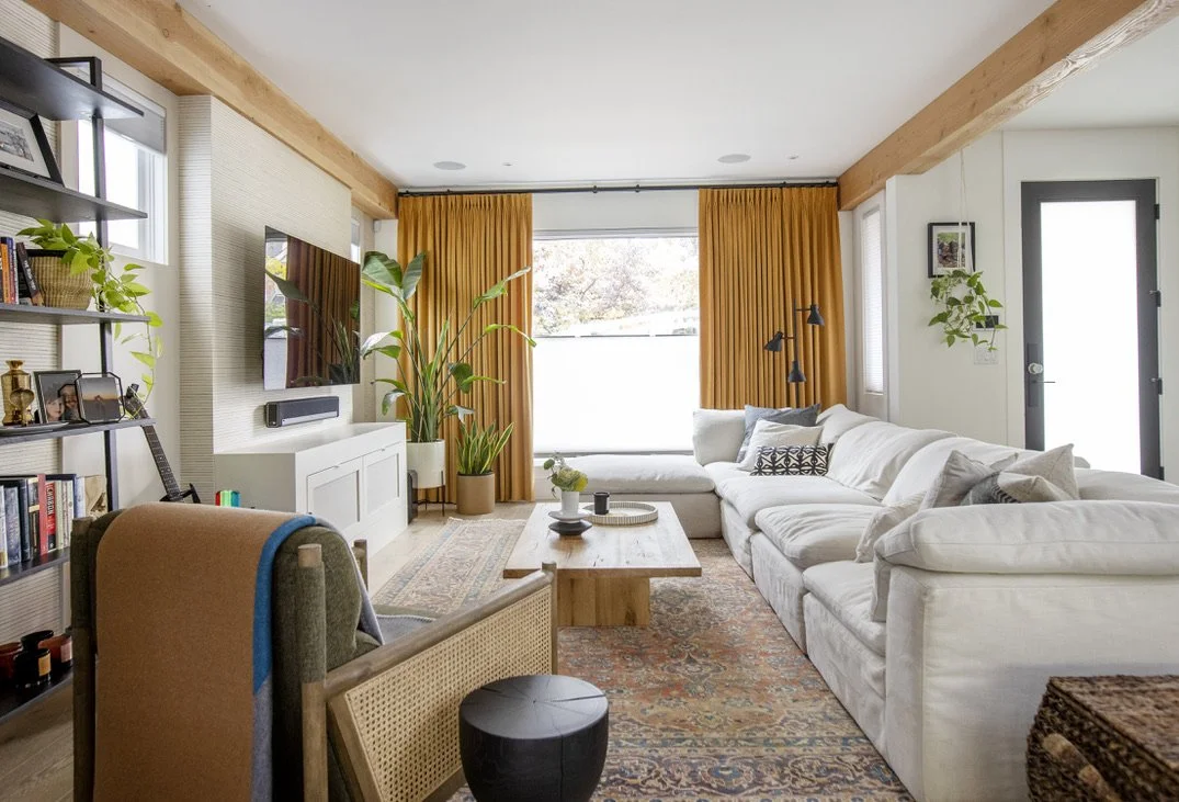 This sitting room has hints of 70s decor to balance the modern furnishings in the living room.
