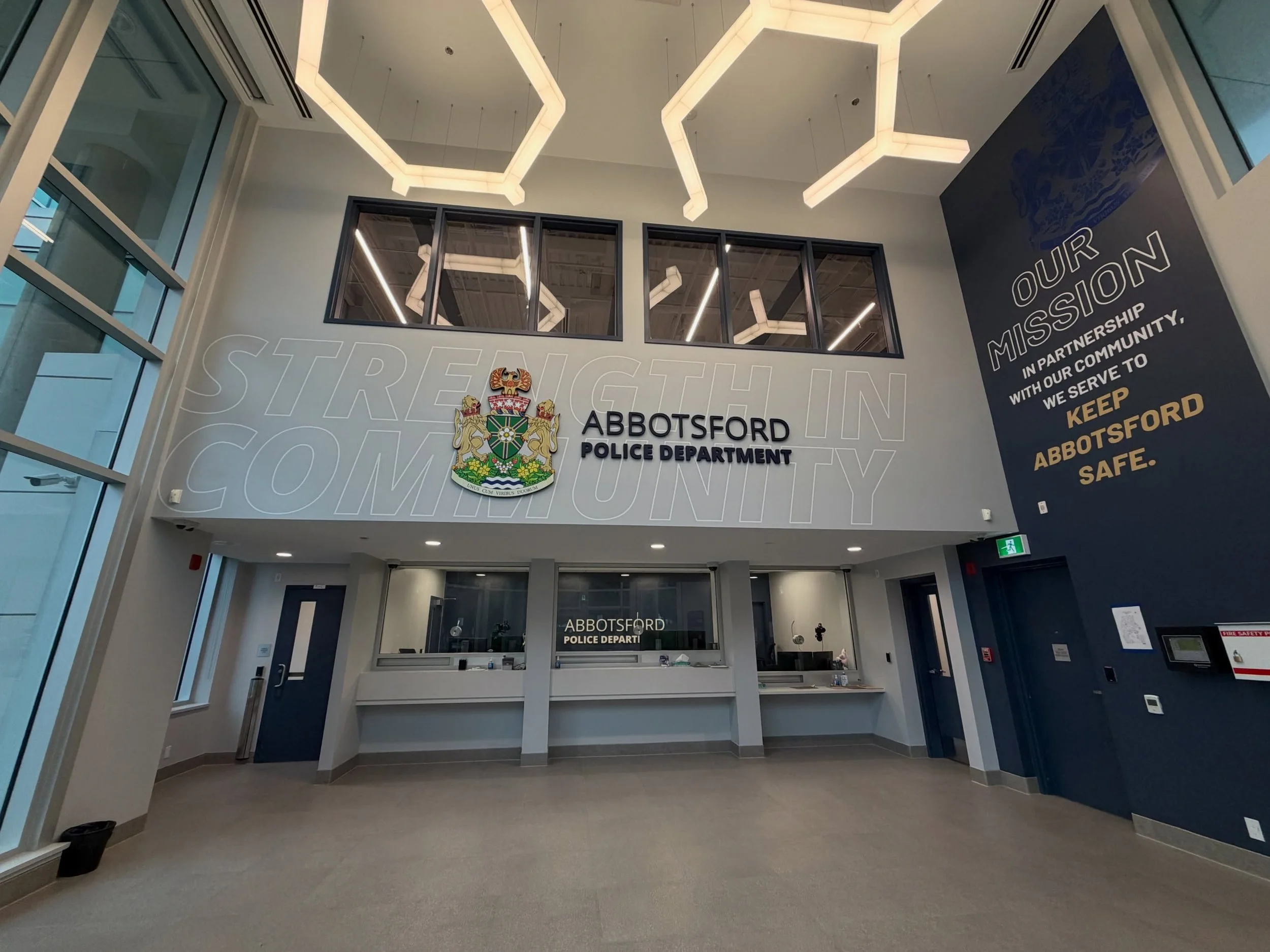A reception area is often the first point of contact between an organization and their community. For @abbotsfordpd&rsquo;s new headquarters, it was important to design signage for their reception area that created a strong sense of connection from t