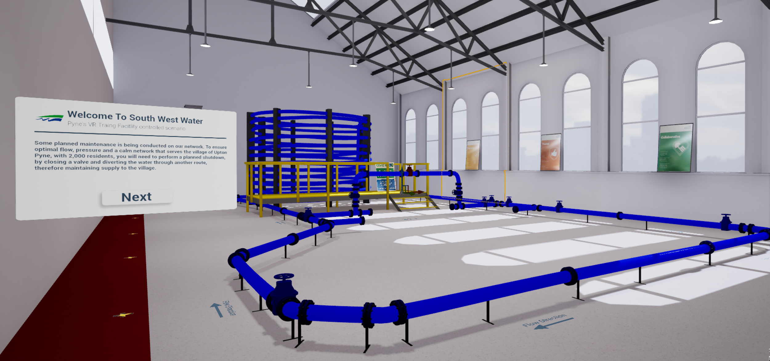 A water training facility with blue pipelines and valves, a white informational sign about water management, and large arched windows letting in natural light.