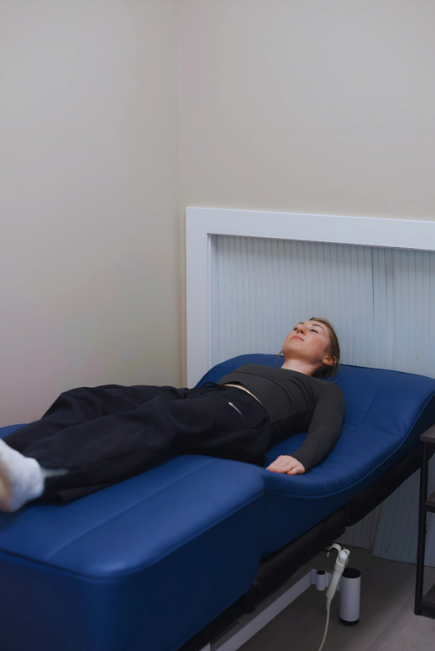 PEMF therapy session at Unwind Wellness in Adel Iowa for recovery and wellness