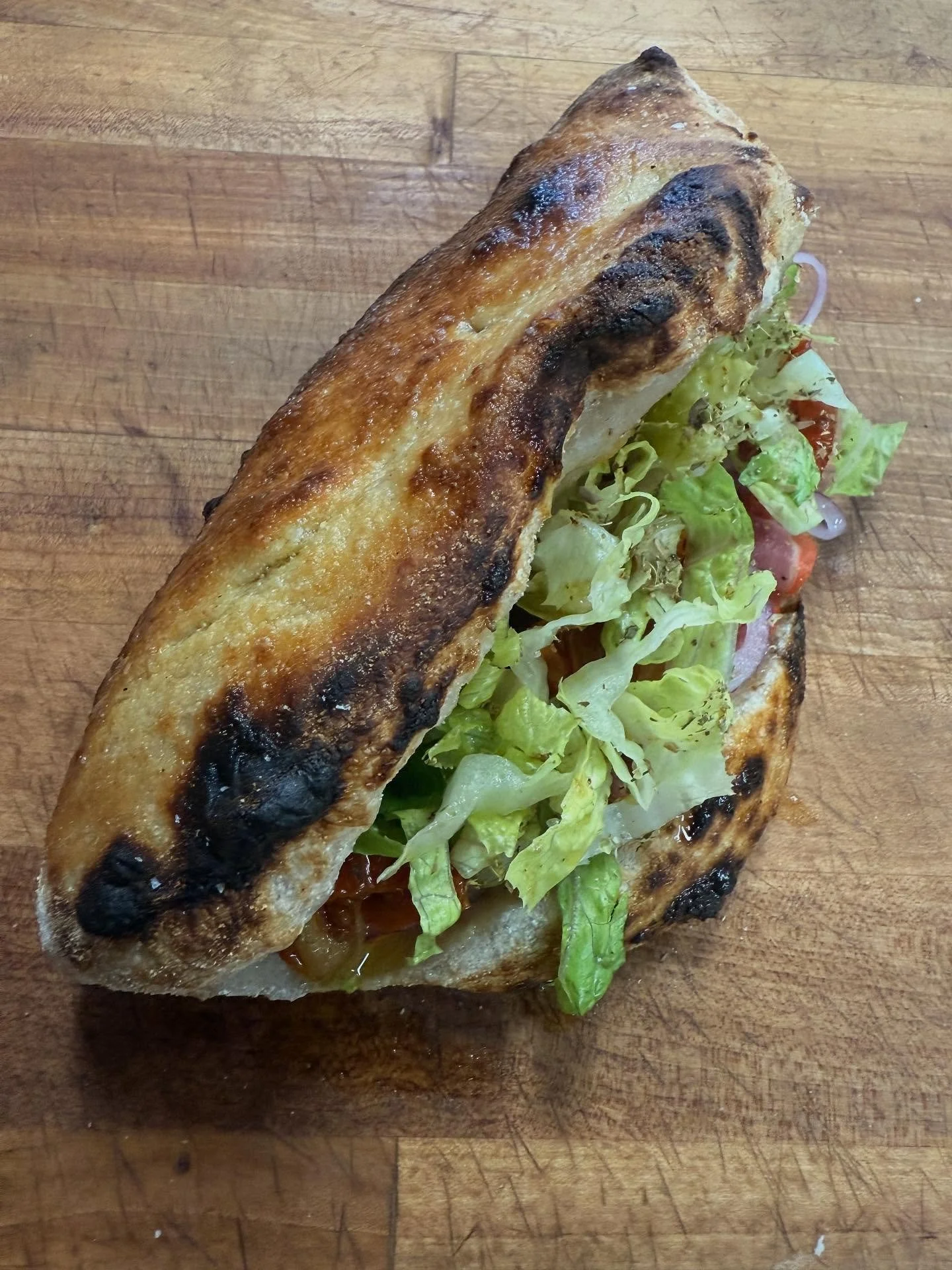 Panouzzos for lunch.  The choice is yours, we will be here all day.

Italian Hoagie Panouzzo - spicy hoagie spread, mozz, French ham, gabagool, lettuce, sundried tomato, onions, oregano