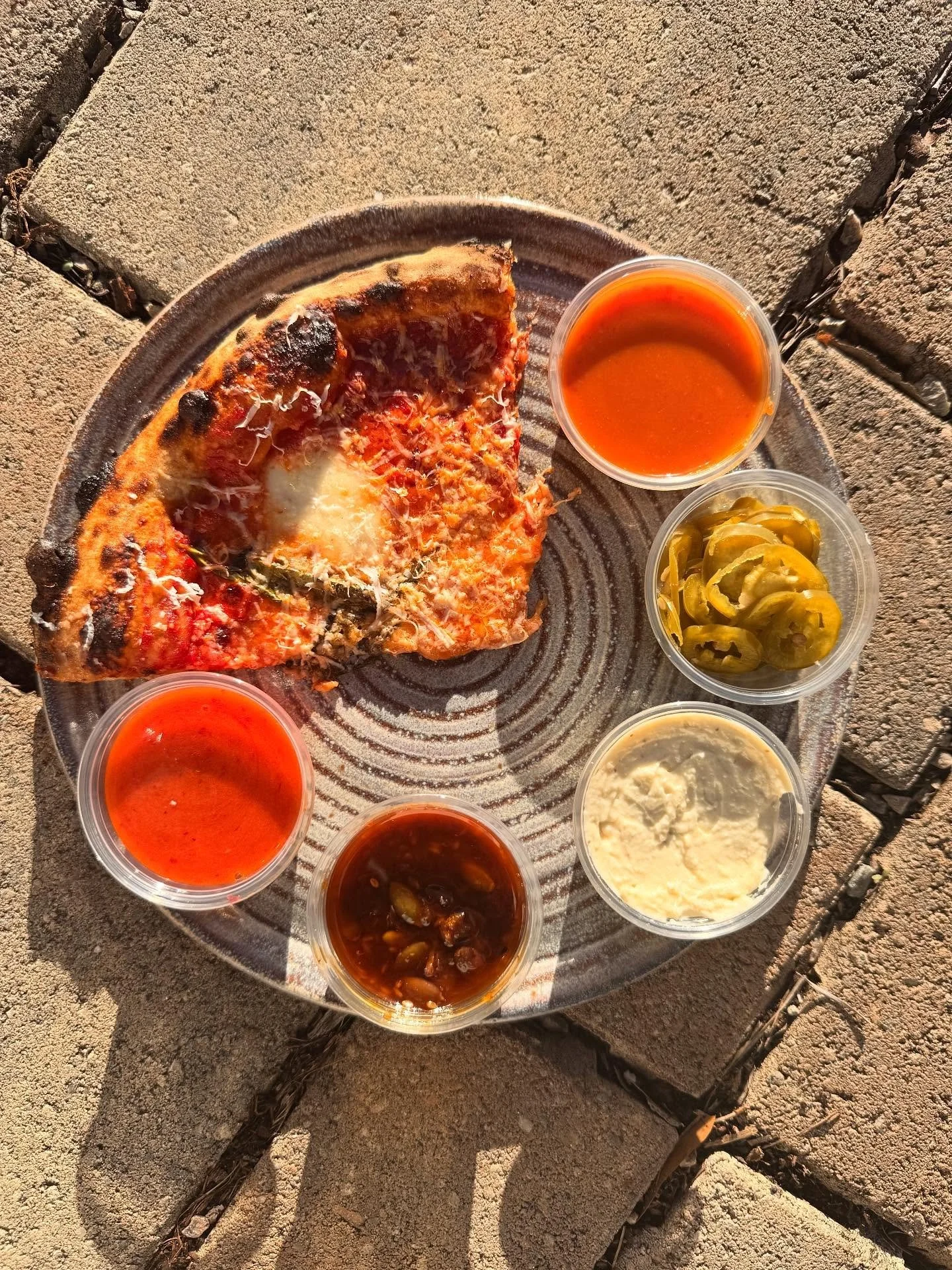 Sometimes you just want to kick up you pizza.  We have a pretty great selection of add ons to give you a little more bang for your slice.  All homemade from your favorite pizza window.

Hot Sauce
Pickled Jalapeno
Creamy Garlic Dip
Apricot Salsa Macha
