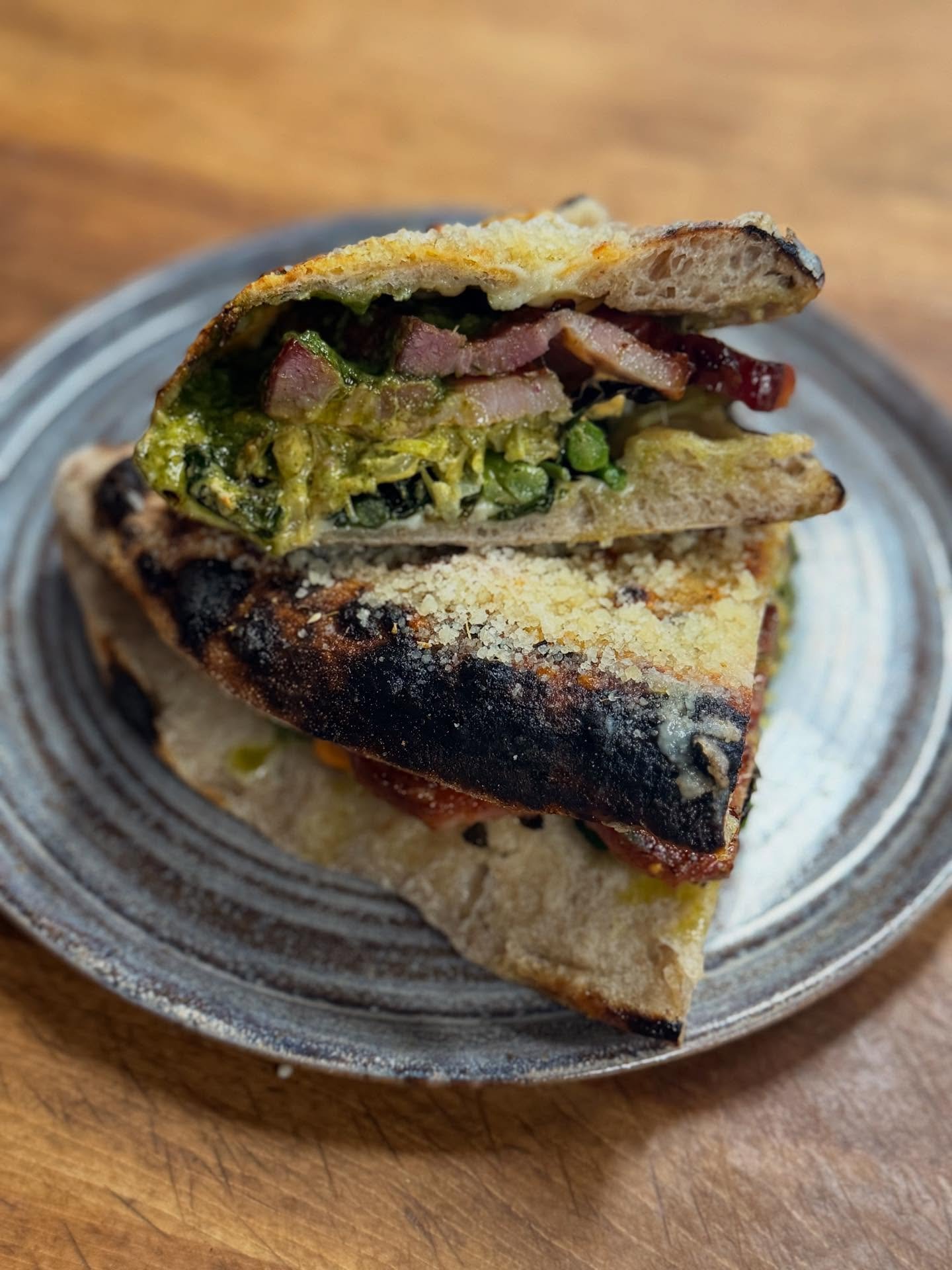 Panouzzos are back and so are calzones.  Come snag some lunch. 

Panouzzo - smoked pancetta, smoked fontina, roasted broccoli and fennel, chili mayo, salsa verde, served with voodoo chips