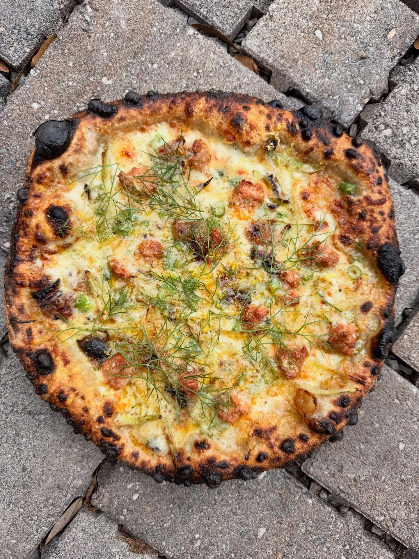 New sausage pizza on this week.  Took another little trick from @danricher on this one.  We made a super rich and tasty stock using parm rinds and smoked pancetta skins.  We add little dollops of the gelatinous stock before the pizza hits the oven an