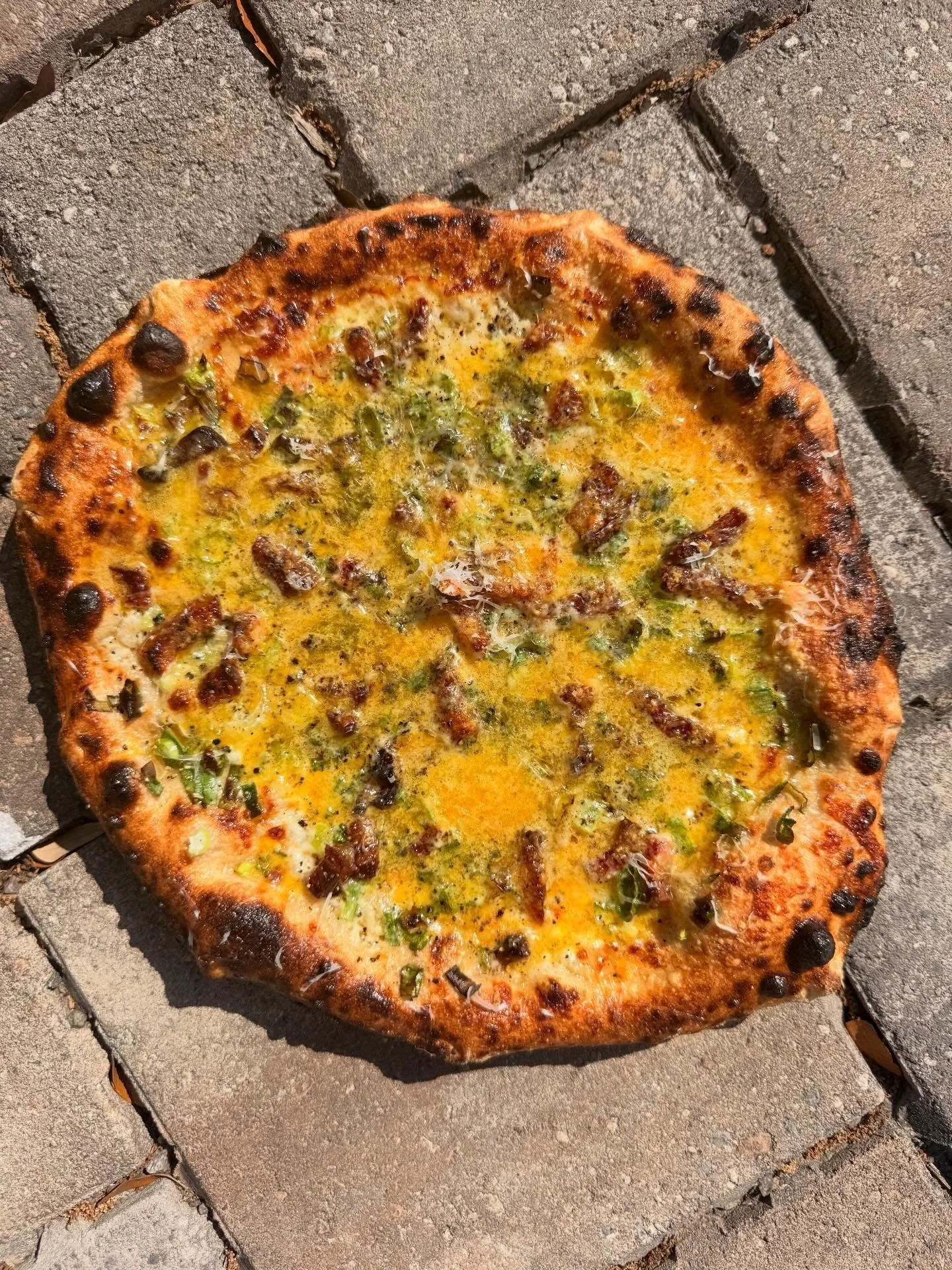 When you love pasta, but you own a pizza shop.  Carbonara pizza comes and goes in many different forms here.  This one has all the traditional elements plus a healthy dose of spring onions and maybe a little too much @redbeardfarms egg yolk all on ou