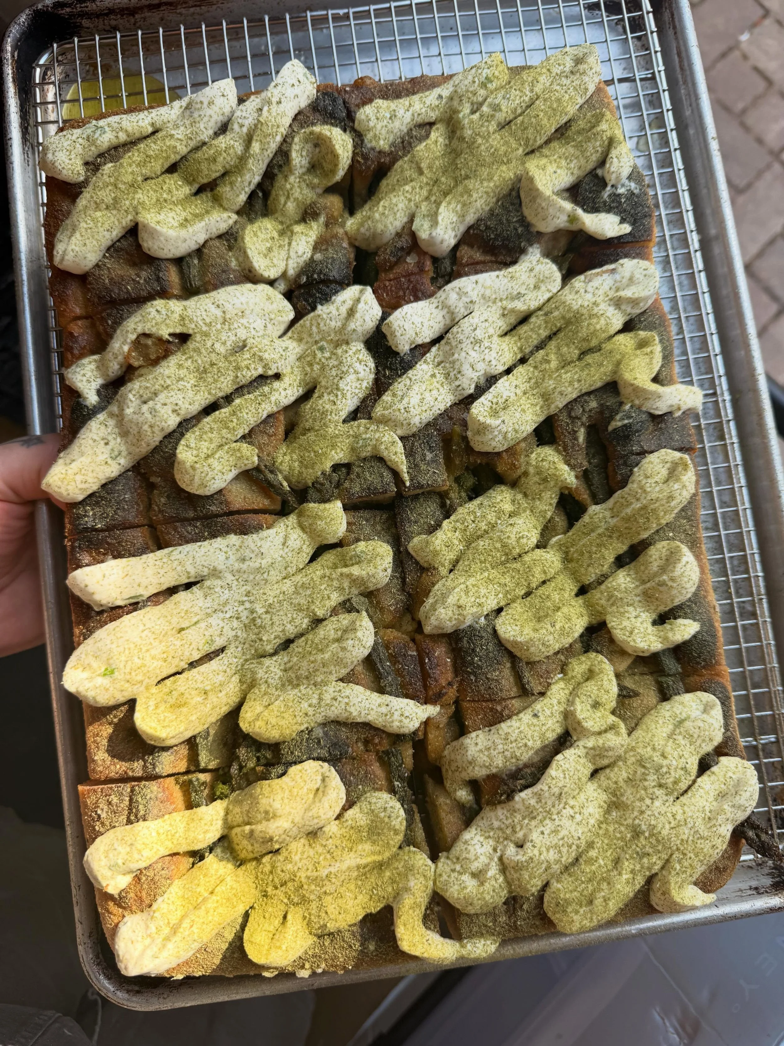 Focaccia is making a comeback at the shop lately.  Always seasonal, always changing.  Last day for this one, so come try it while you can. 

Focaccia - asparagus, roasted garlic, scallion cream cheese