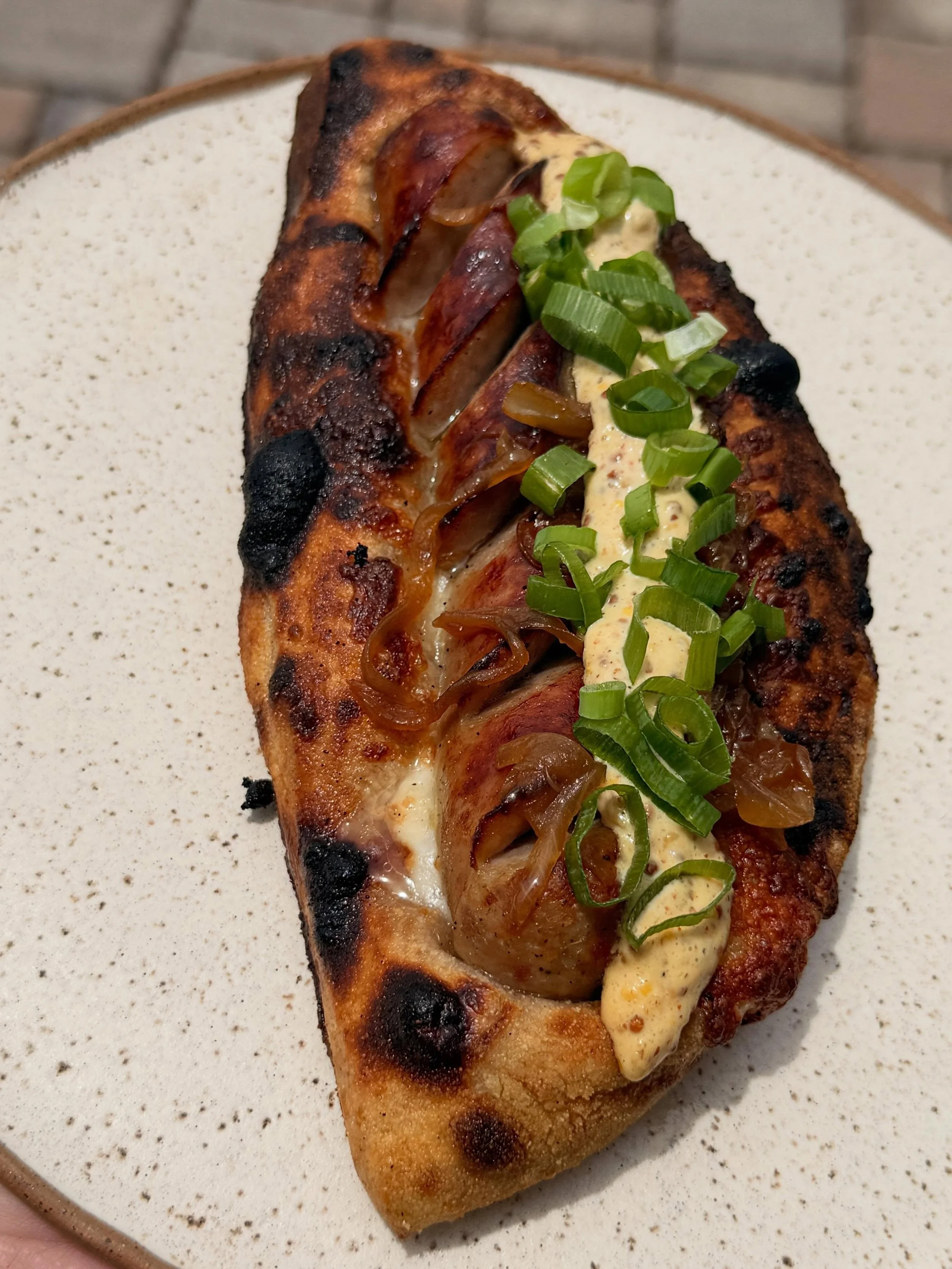 It&rsquo;s officially grilling season or something like that.  We got brats all weekend long, pizza dog style.  Poached in @middlejamesbrewing sweet potato ale and topped with caramelized onions and stone ground Dijonaise.  So do with that what you w