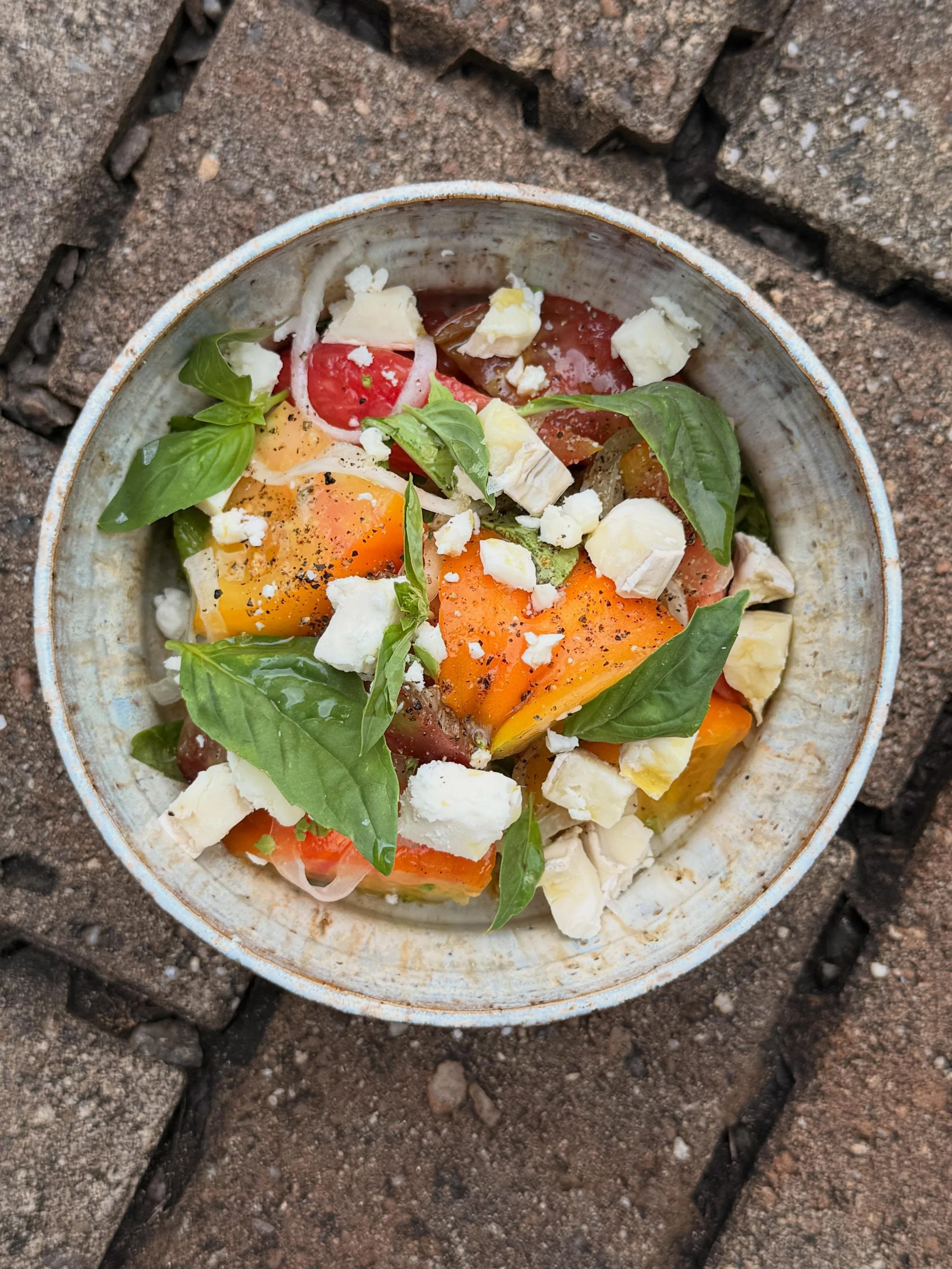 tomato season has officially begun here in the south.  Tomatoes are splattered all over the menu and there is more to come.  This one is simple and easy, perfect to let the great quality of ingredients shine. 

heirloom Tomato - goat cheese, pickled 
