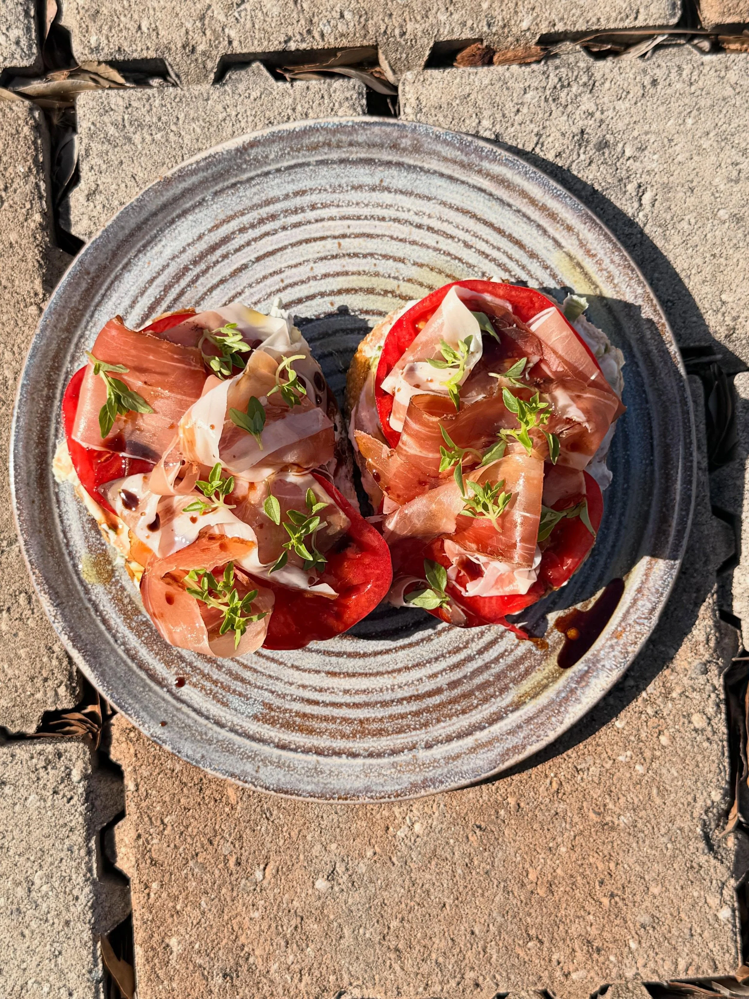 Tomatoes have officially hit the bagel menu this week.  Simple. Delicious. Classic 

Heirloom Tomato - whipped ricotta, prosciutto, basil, vin cotto