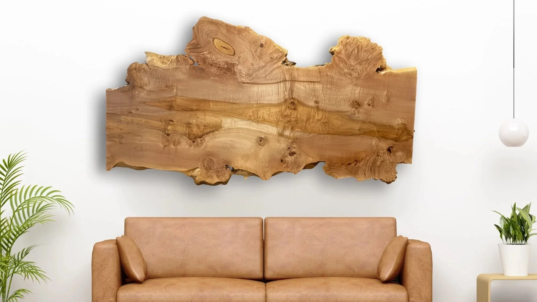 Big Leaf Maple Burl Hanging Wall Art Above a Brown Leather Couch