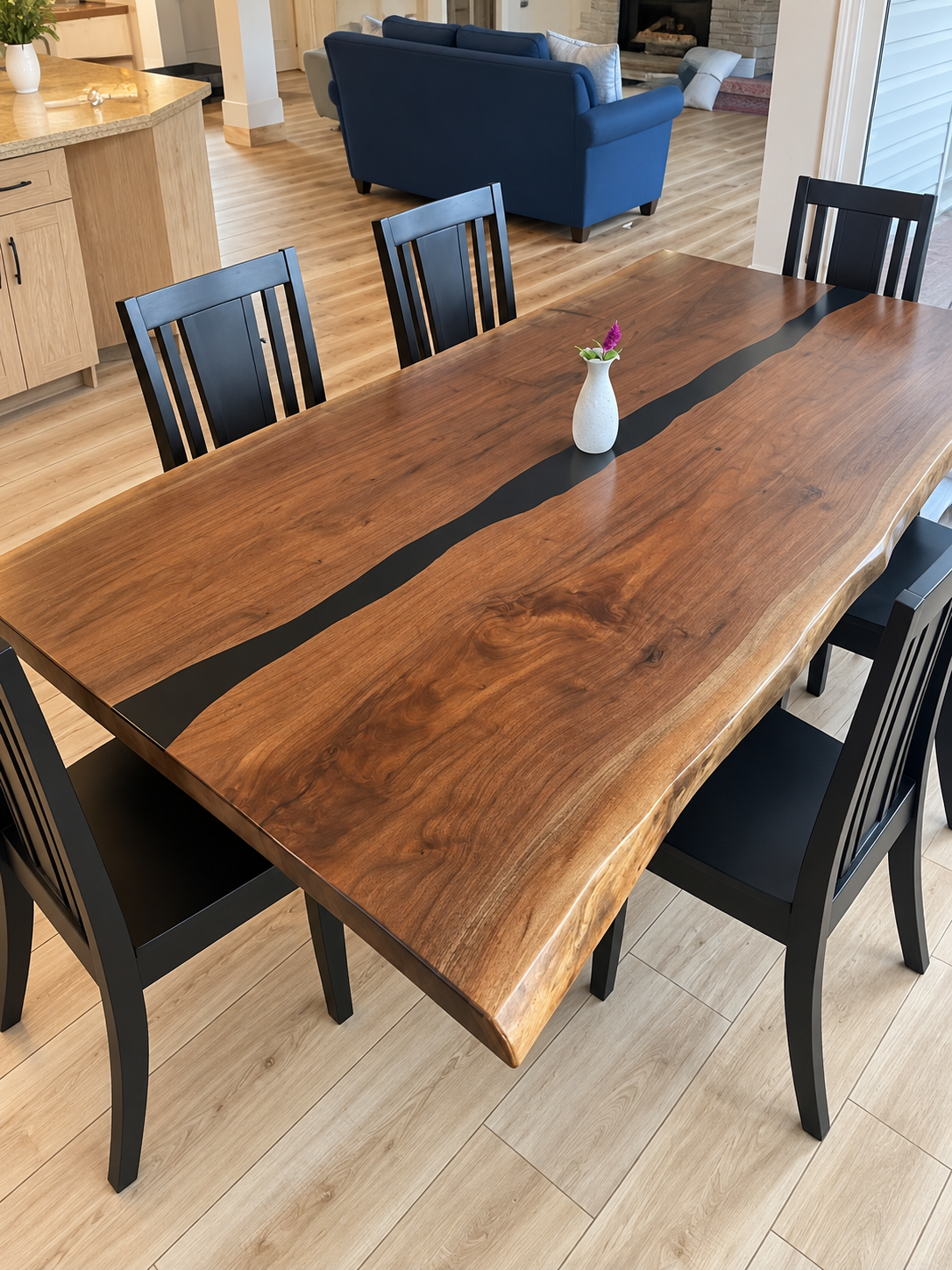 Elevated dining room with walnut river table.png