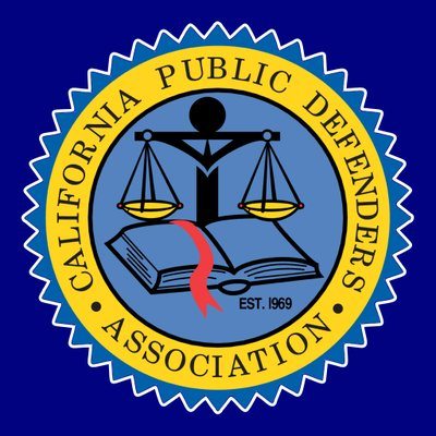 Seal of the California Public Defender's Association featuring a balanced scale, a gavel, and an open book with a red ribbon on a blue background.