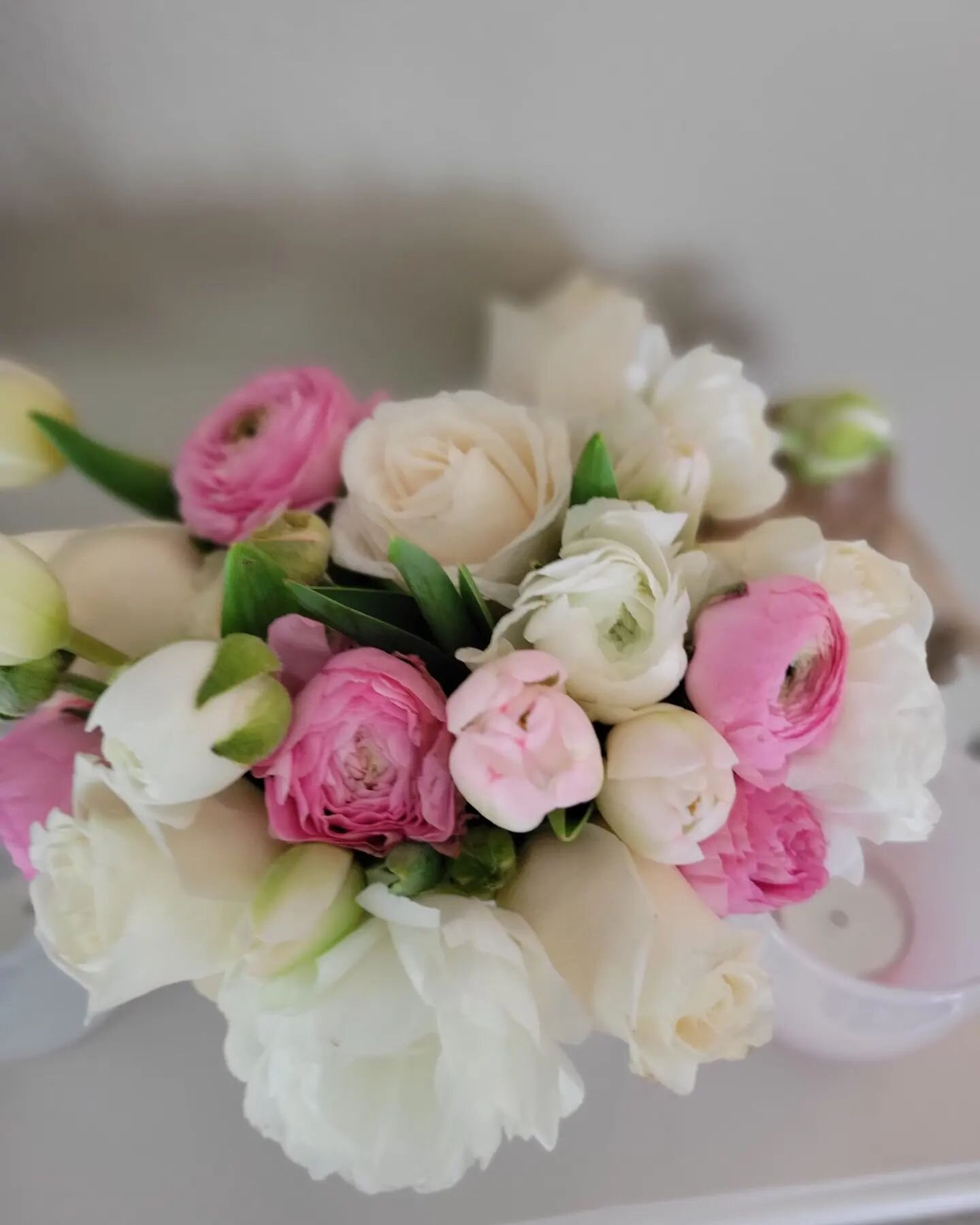 April showers bring May flowers!

Florals are a lovely addition to any event, especially an &quot;April Shower&quot; baby shower. Hues of pinks, creams, &amp; white create a whimsical look. Subtle splashes of soft pink throughout let guests know it's