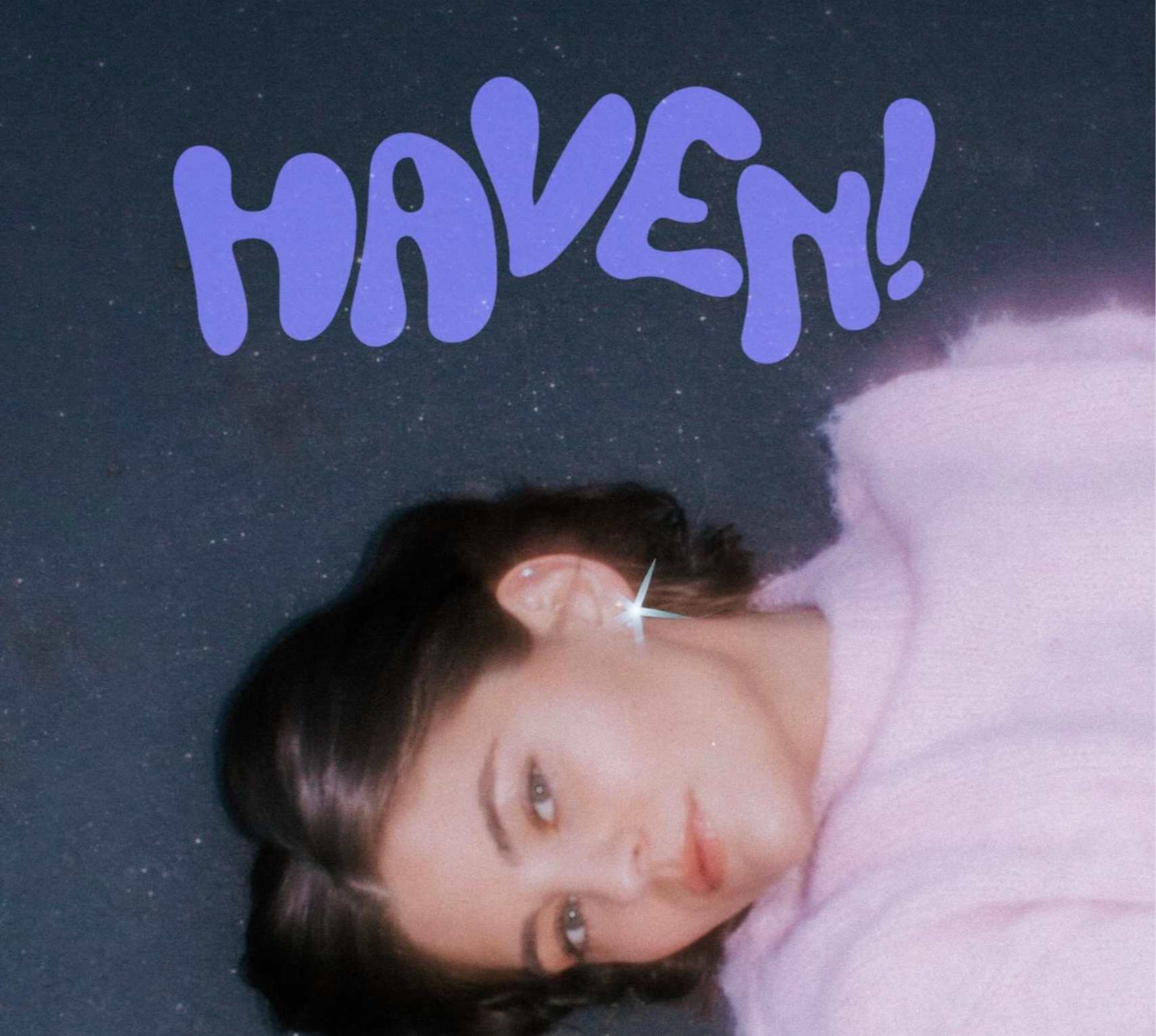 A woman with dark hair lying down on a dark starry background, wearing a pink top, with the word 'HAVEN!' in purple stylized letters at the top.