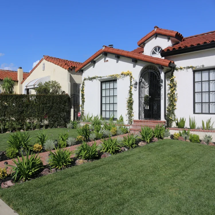 Professional roof maintenance for a Solvang home, including clay tile inspection and oak debris removal from valleys.