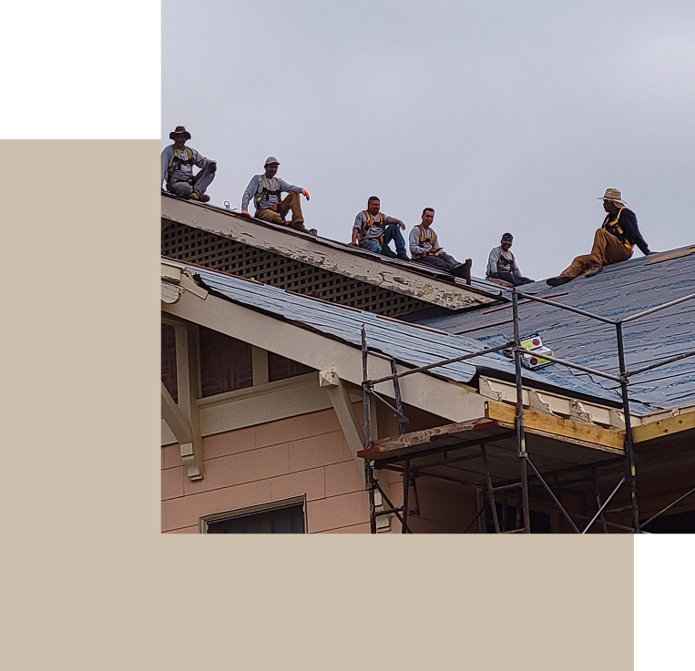Professional roofing crew performing a roof inspection and repair on a residential property in Santa Barbara.
