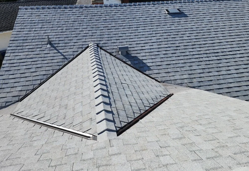 Finished Landmark Home Edition asphalt shingle hip and ridge with crisp new shingles on a Santa Barbara roof after replacement.