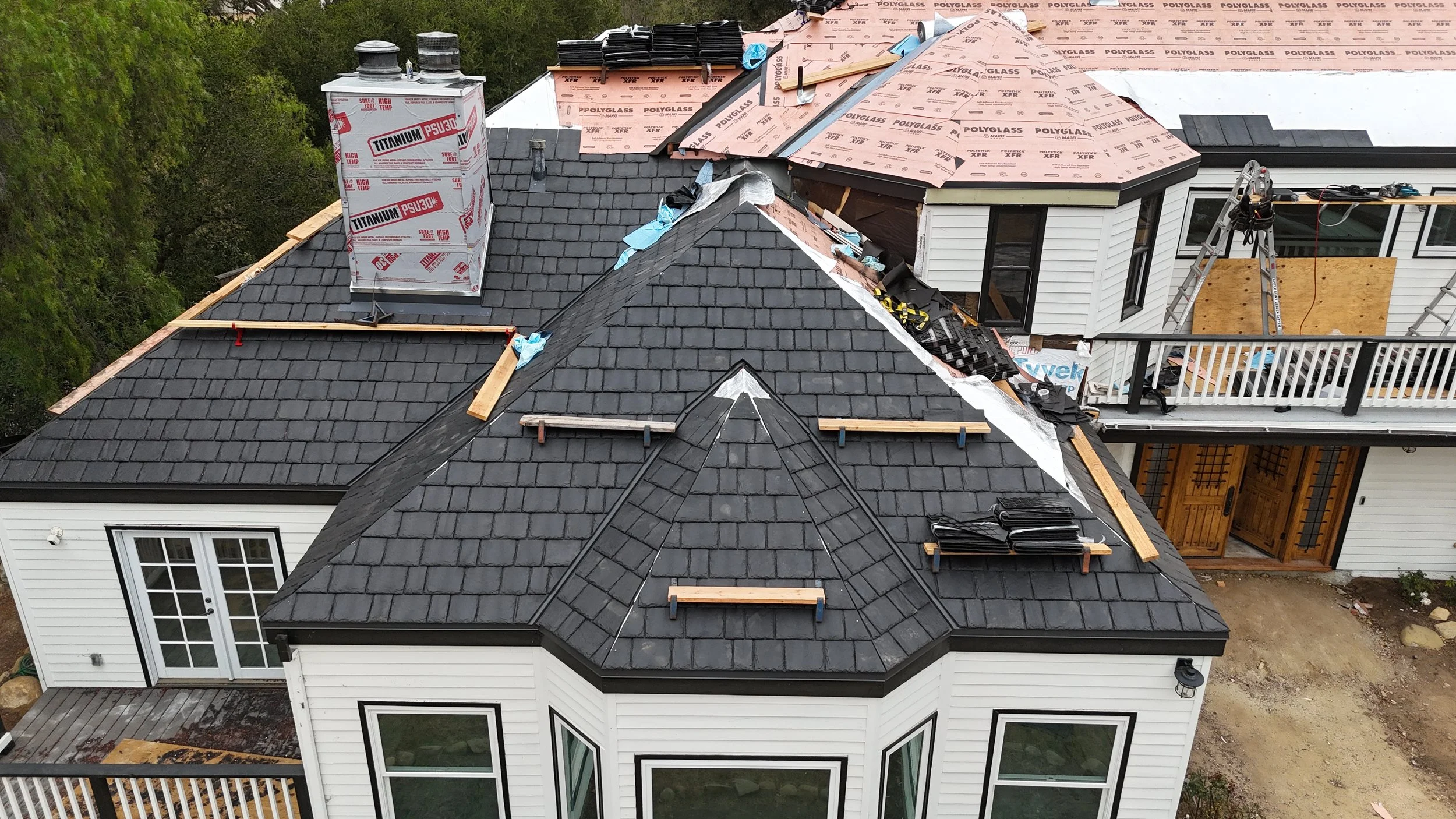 Brava composite slate being installed over new underlayment