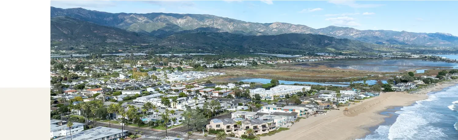 Aerial view of Carpinteria, CA, showing the coastal town and foothills served by our local roofing company.