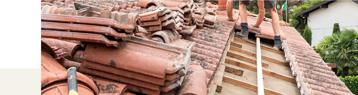 Roofers repairing a clay tile roof in Santa Barbara, CA