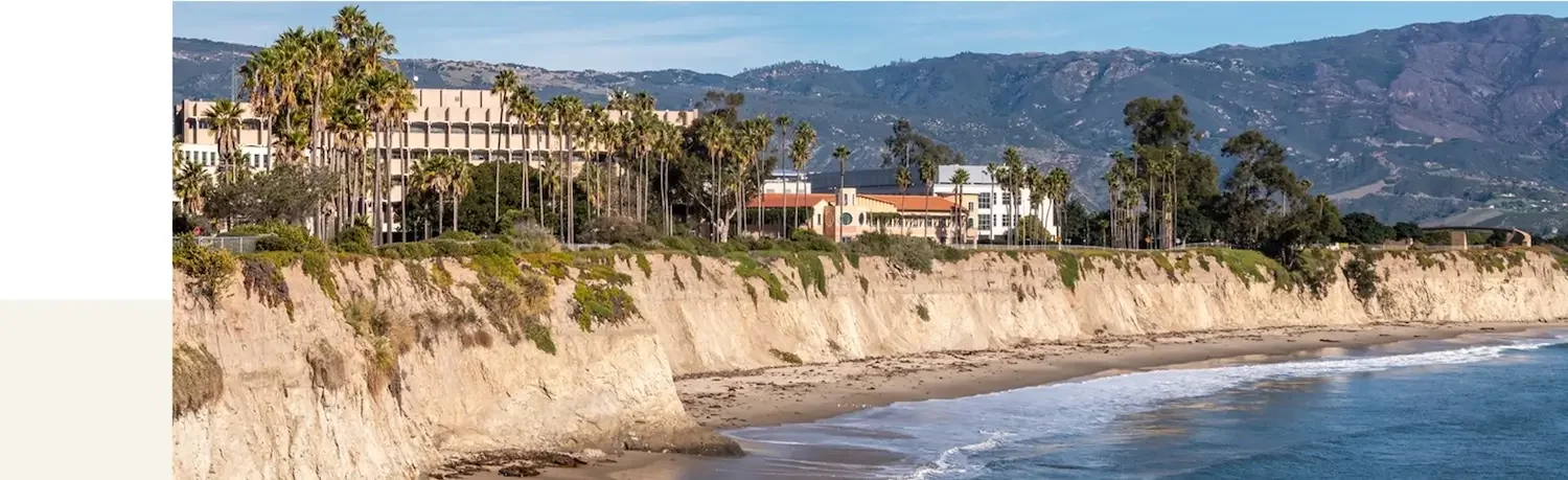 Aerial view of coastal cliffs and palm trees in Goleta, California, representing local roofing service area.