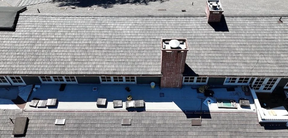 Drone view of a synthetic slate roof replacement on a large single‑family home in Santa Barbara, California