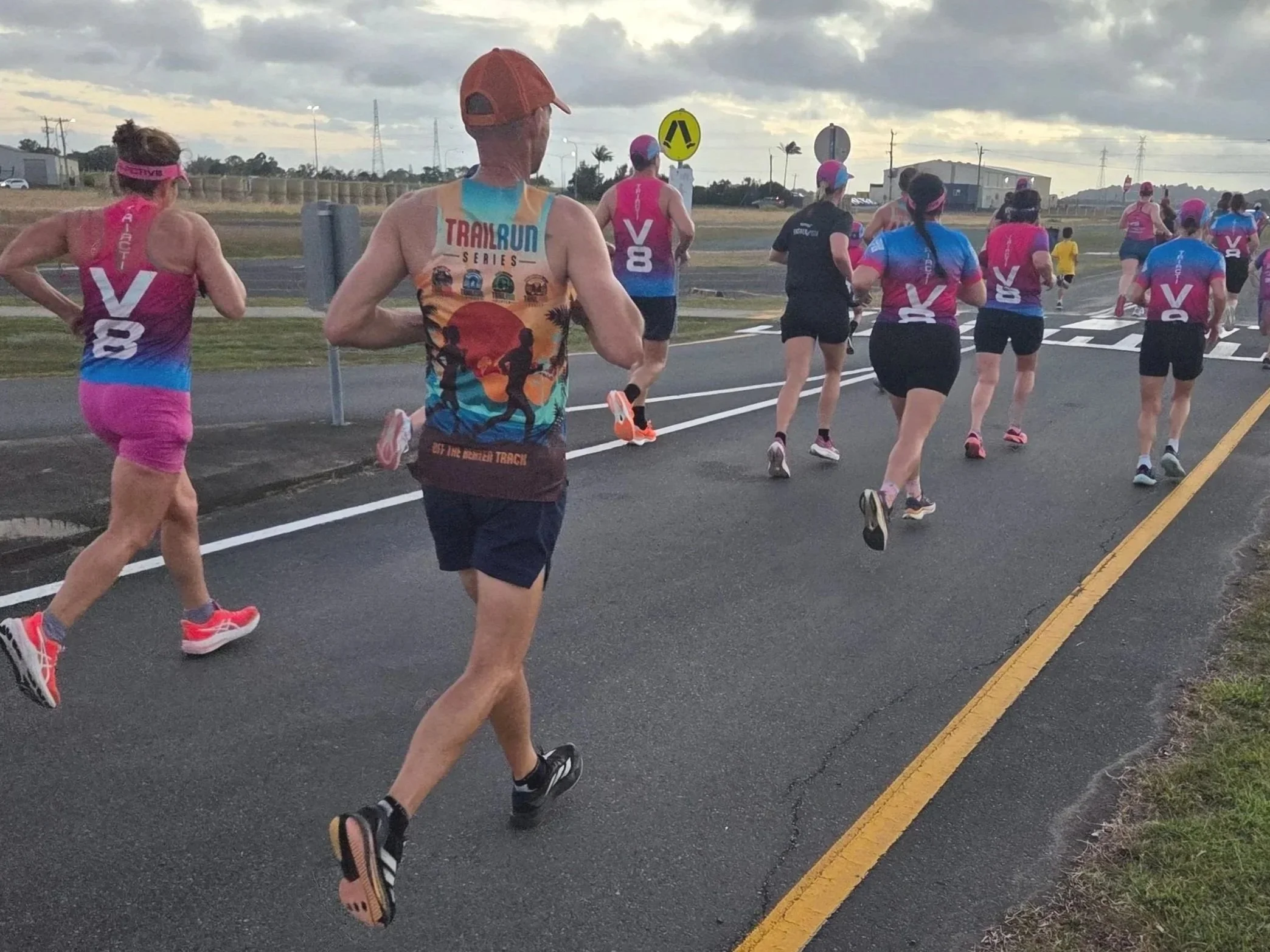 A group of runners running on a path as part of an event