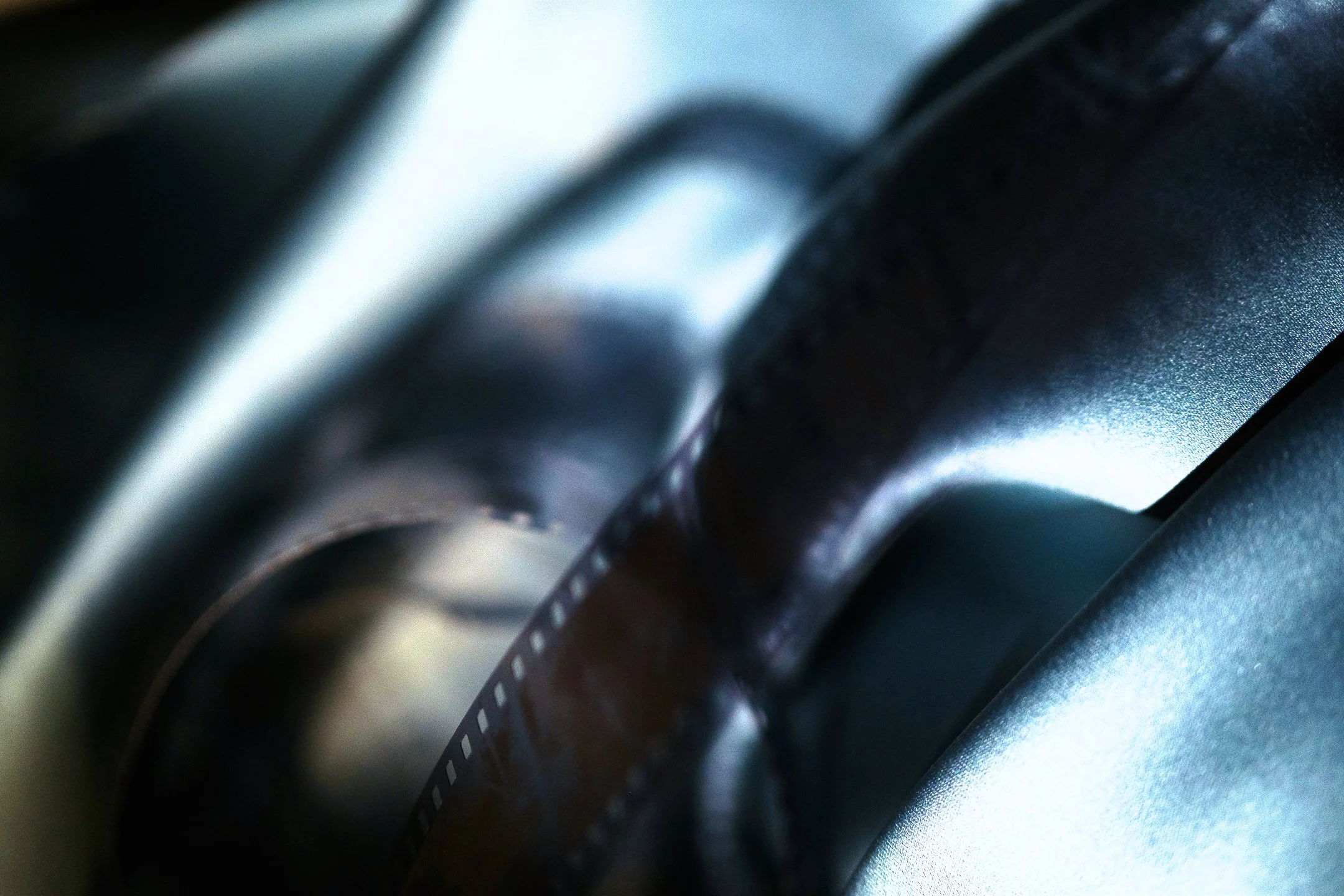 Close-up of a film strip on a vintage film camera.