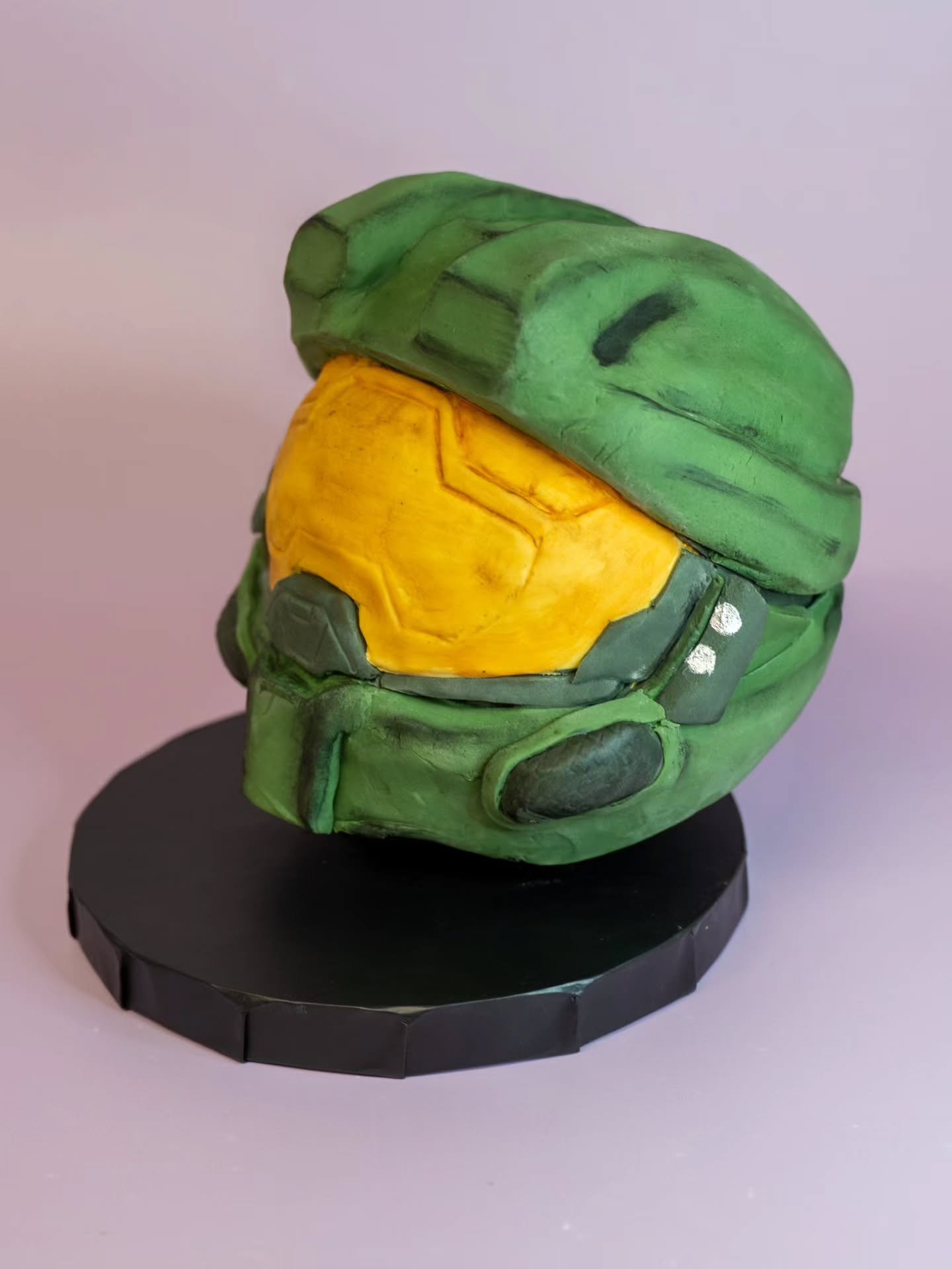 This was a keepsake fondant topper. 

These are made on their own individual board so that they can be placed on the top of a cake then easily removed again for putting on display! 

A customer (many many months ago) wanted this helmet so it was the 