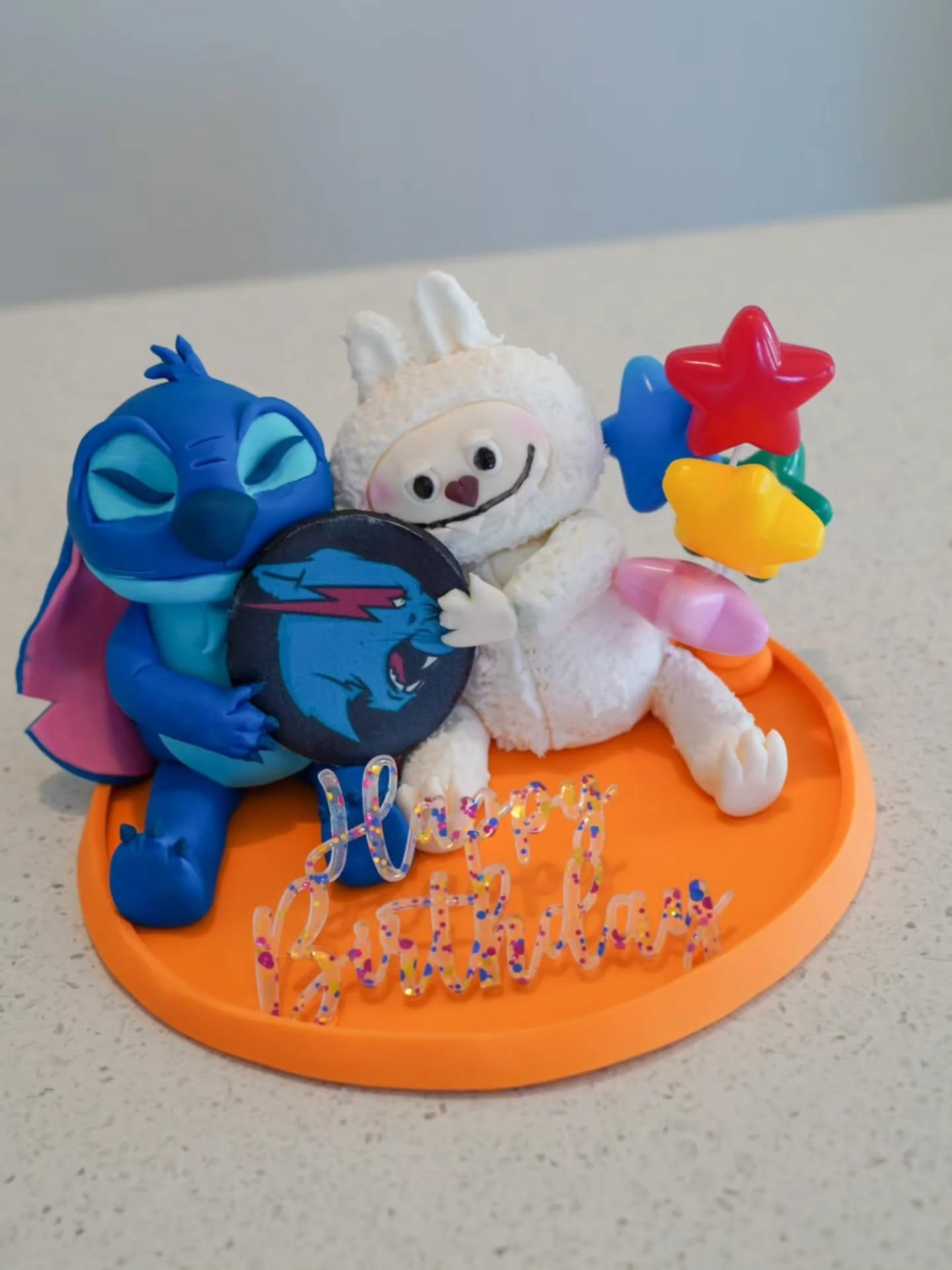 When you need a cake topper to have 'Stitch and Labubu hugging with a Mr Beast logo".......done ✔️

From memory, I think this one took about 5.5 hours to put together....they always take longer than you think! 

As with most fondant toppers you 