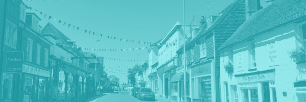 Image of Hailsham high street showing independent shops and bunting