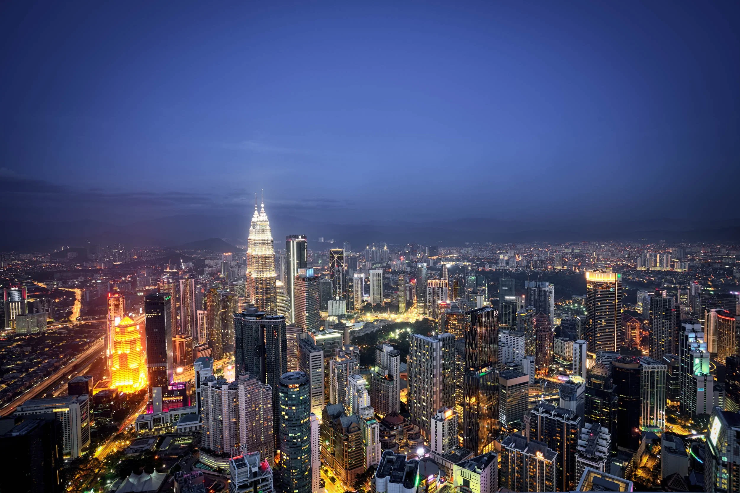Petronas Towers Lit Up During Blue Hour.jpg
