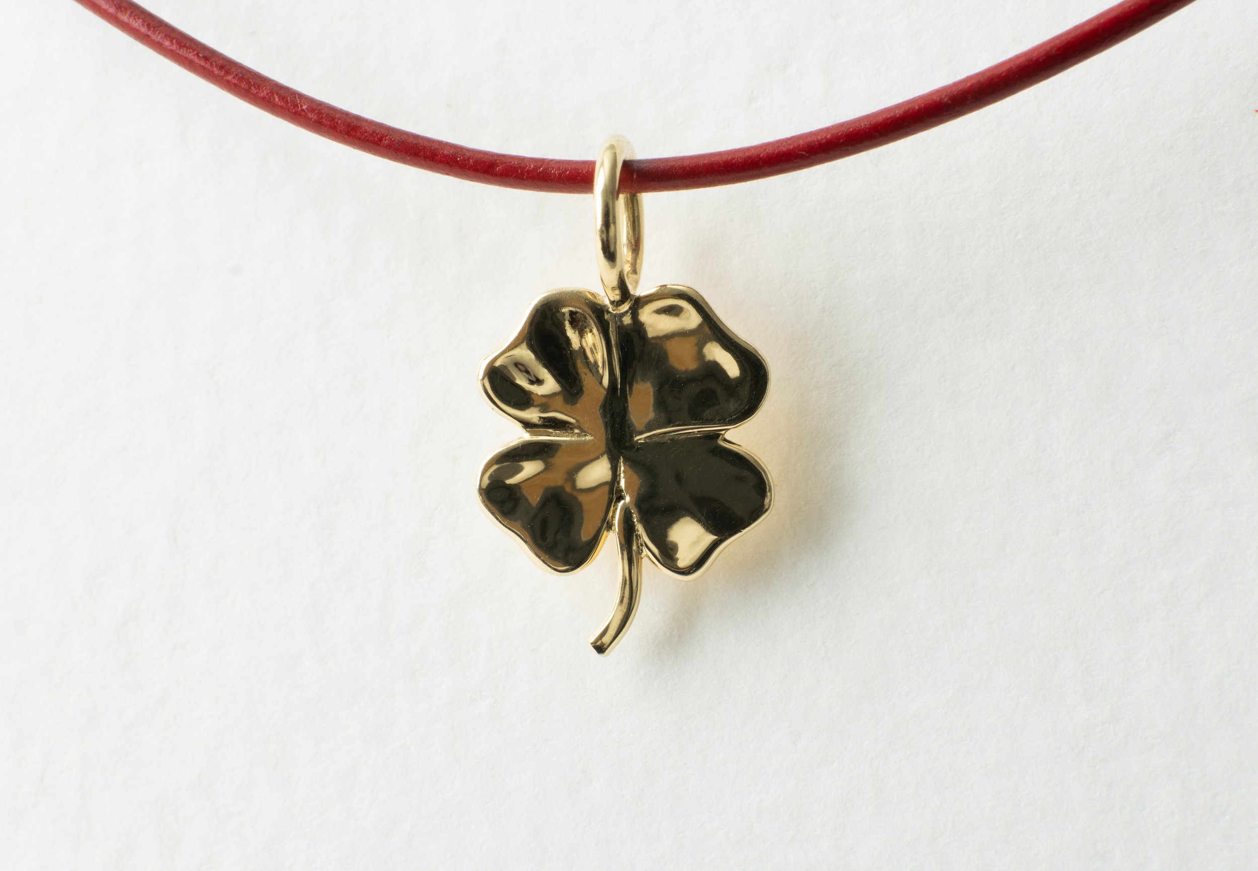 gold shamrock large pendant on red cord