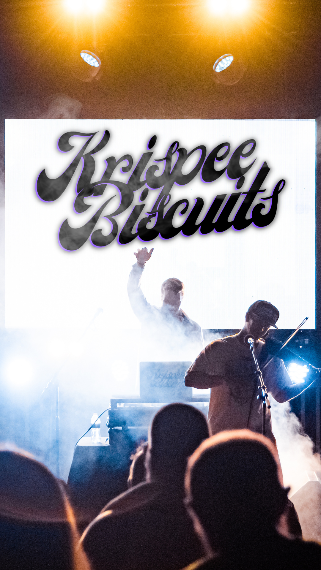 Concert scene with musicians on stage performing against a bright background, large letters reading 'Krispee Biscuits' above them. Wilmington. NC. Headliner. Collab. Main feature. Feature. Success. Music. Live. DJ. Violin. Show. Performance. 
