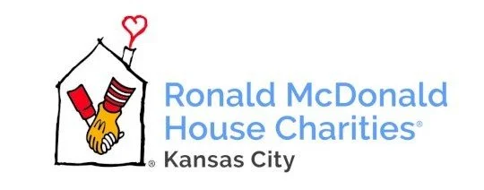Logo for Ronald McDonald House Charities with a house outline, two hands clasping, and a red heart above.