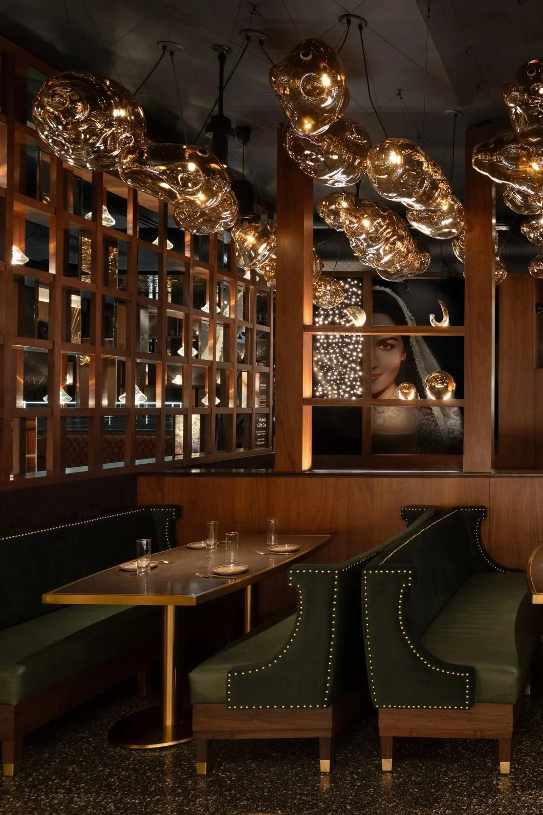 Interior of Tasty Indian Bistro Abbotsford, flagship location designed by Kurtz Design, featuring custom terrazzo flooring, bespoke millwork, semi-precious tables from Jaipur, India, and curated lighting from Delhi, India, showcasing a modern Indian 
