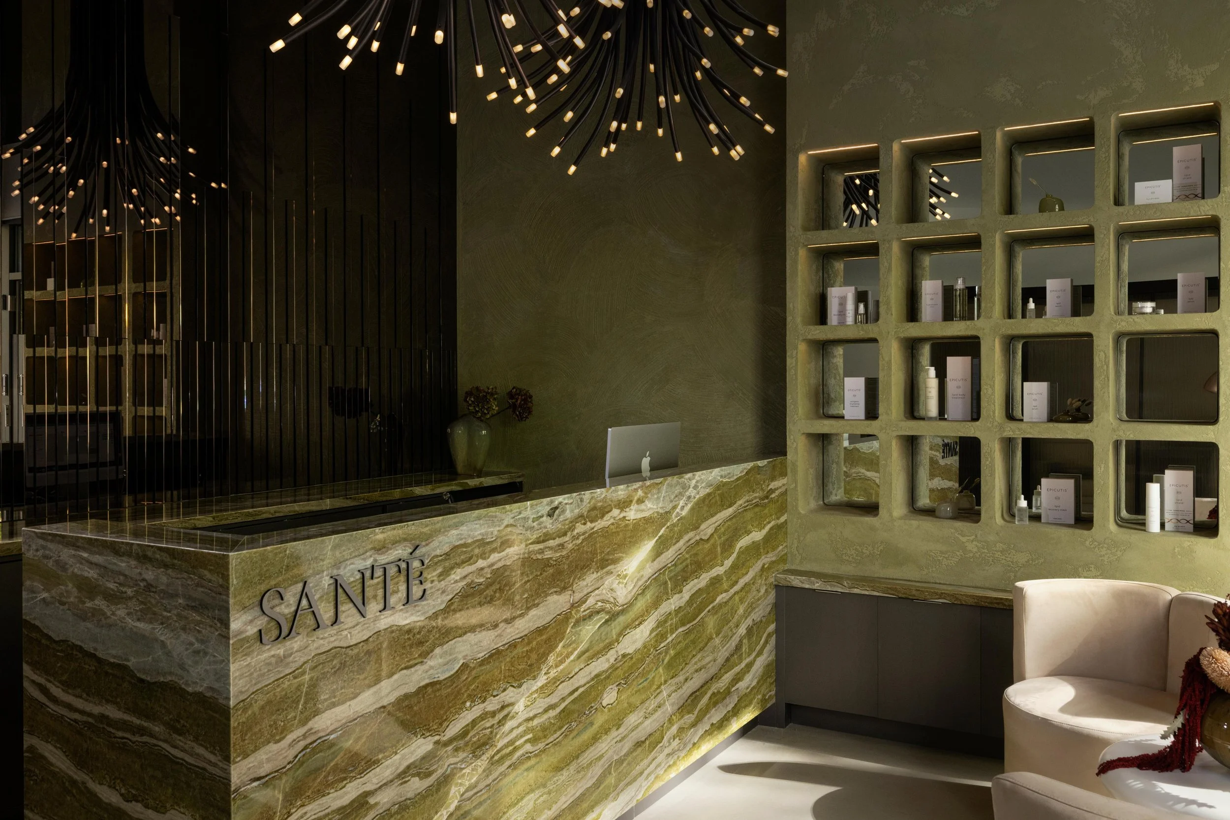 Wellness Interior design of Sante Medical Clinic., a naturopath clinic located in Vancouver, British Columbia. Showing a vibrant green reception and retail, with a canopy of light.

best interior design in Vancouver