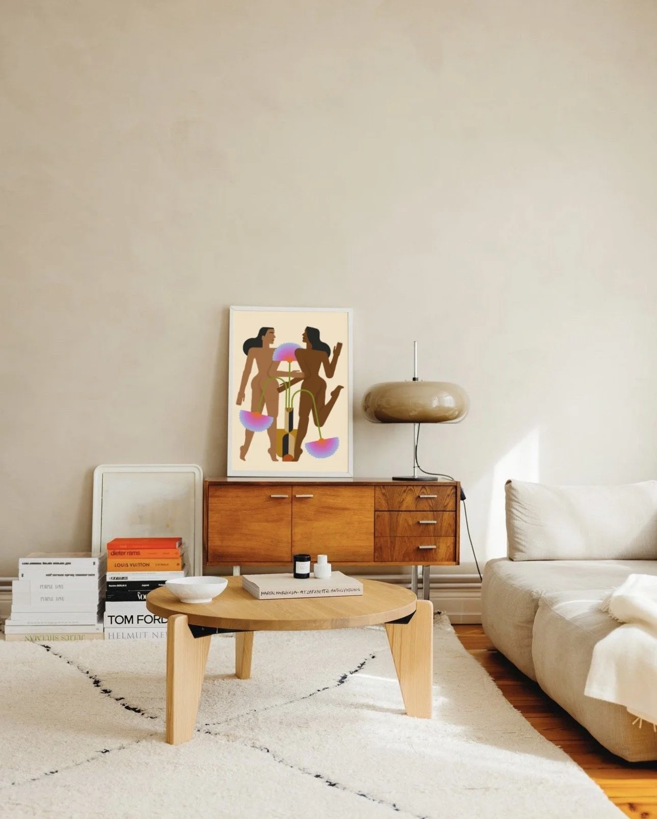 Modern living room with wooden sideboard, abstract art, contemporary lamp, and white sofa.