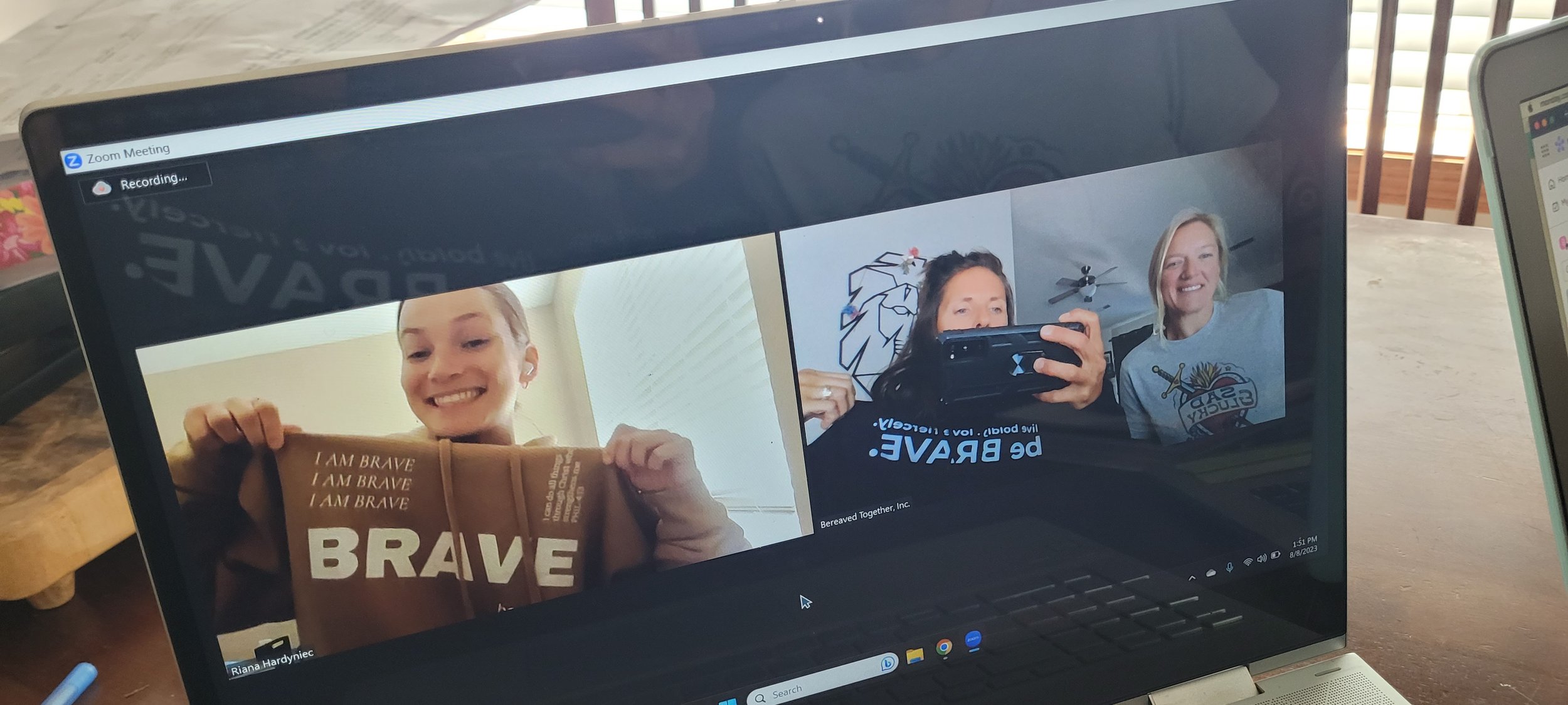 women wearing BRAVE shirts women wearing BRAVE shirts