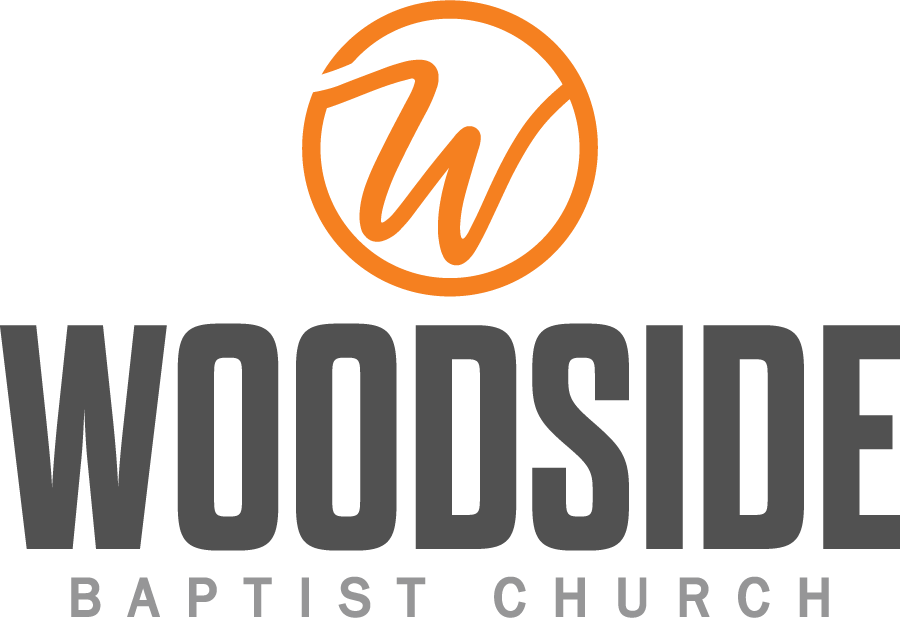 Logo of Woodside Baptist Church featuring a stylized orange 'W' inside a circle and the church name in bold letters.