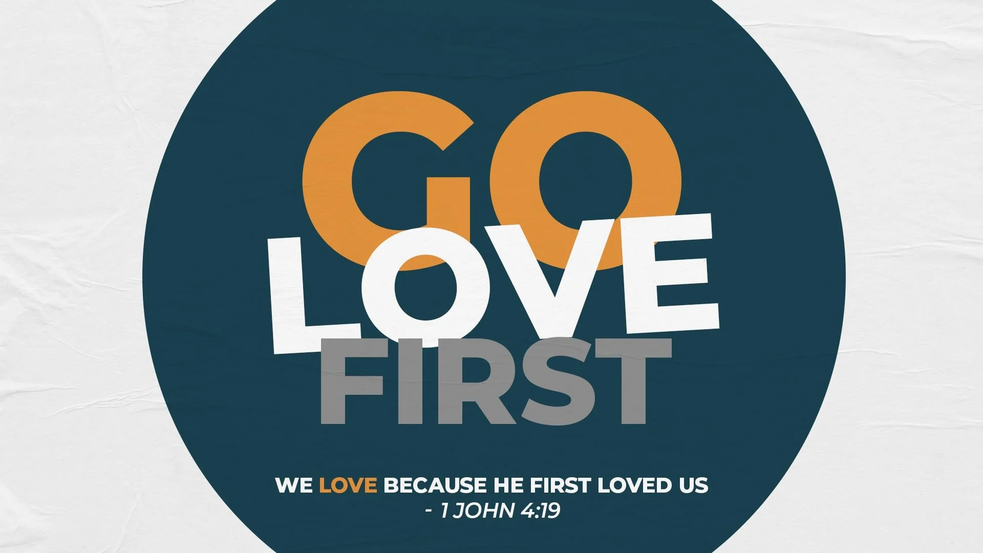 Graphic with the words 'GO LOVE FIRST' in large, colorful letters. Below, a Bible verse from 1 John 4:19 states, 'We love because he first loved us.' The background is a textured, off-white surface.