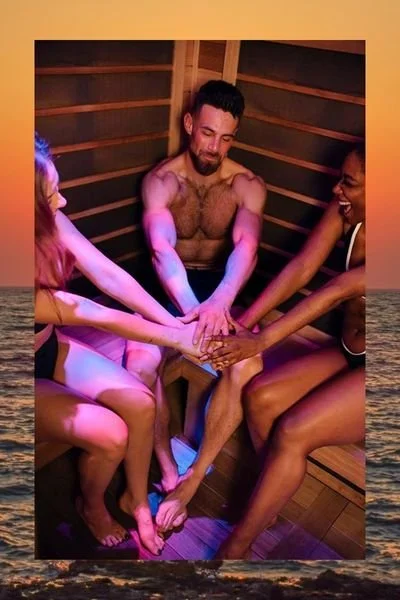 people in infrared sauna celebrating work