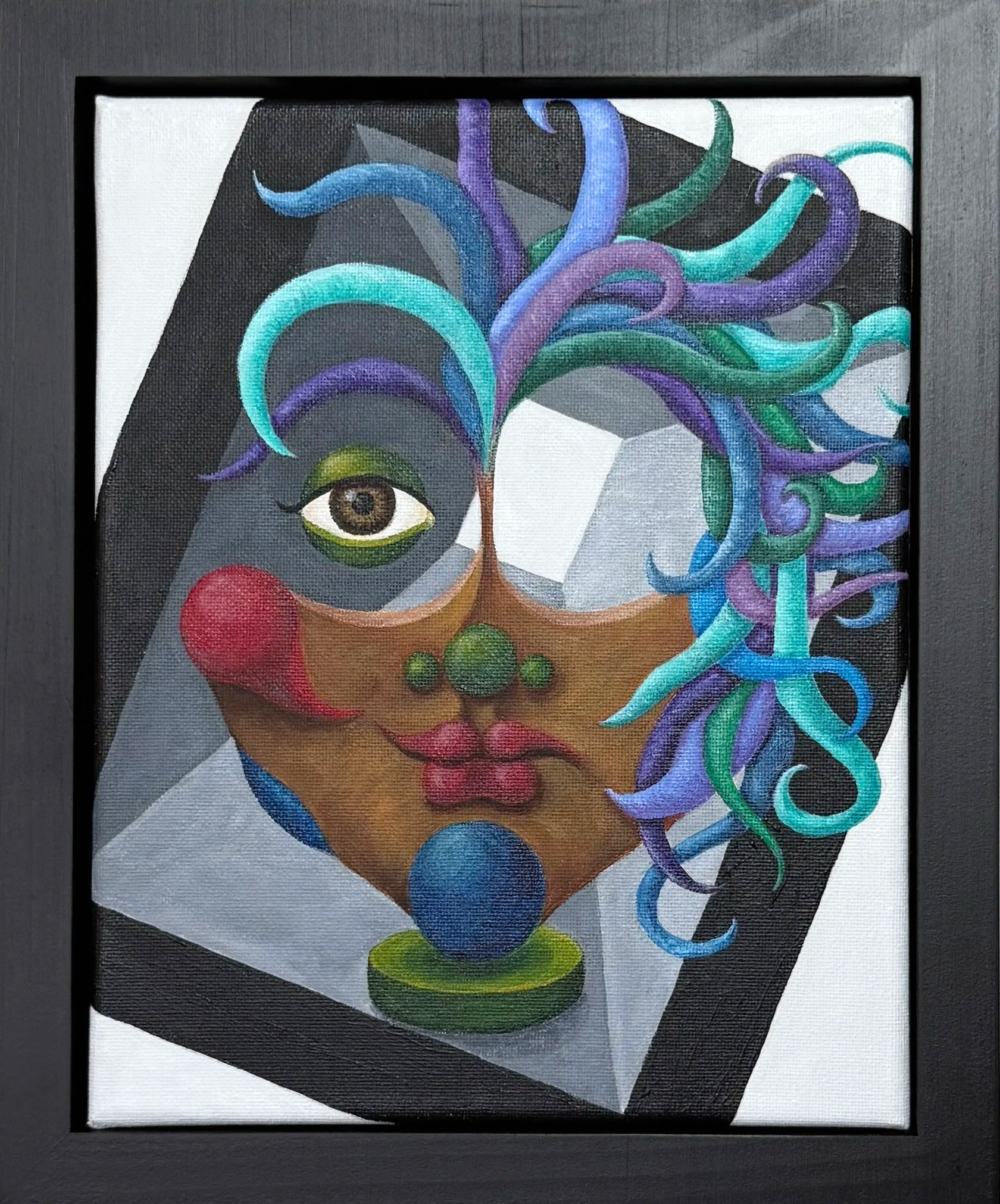 A framed artwork of a woman's face with colorful swirling hair, painted with expressive brushstrokes, featuring a brown eye, red lips, and a white background.