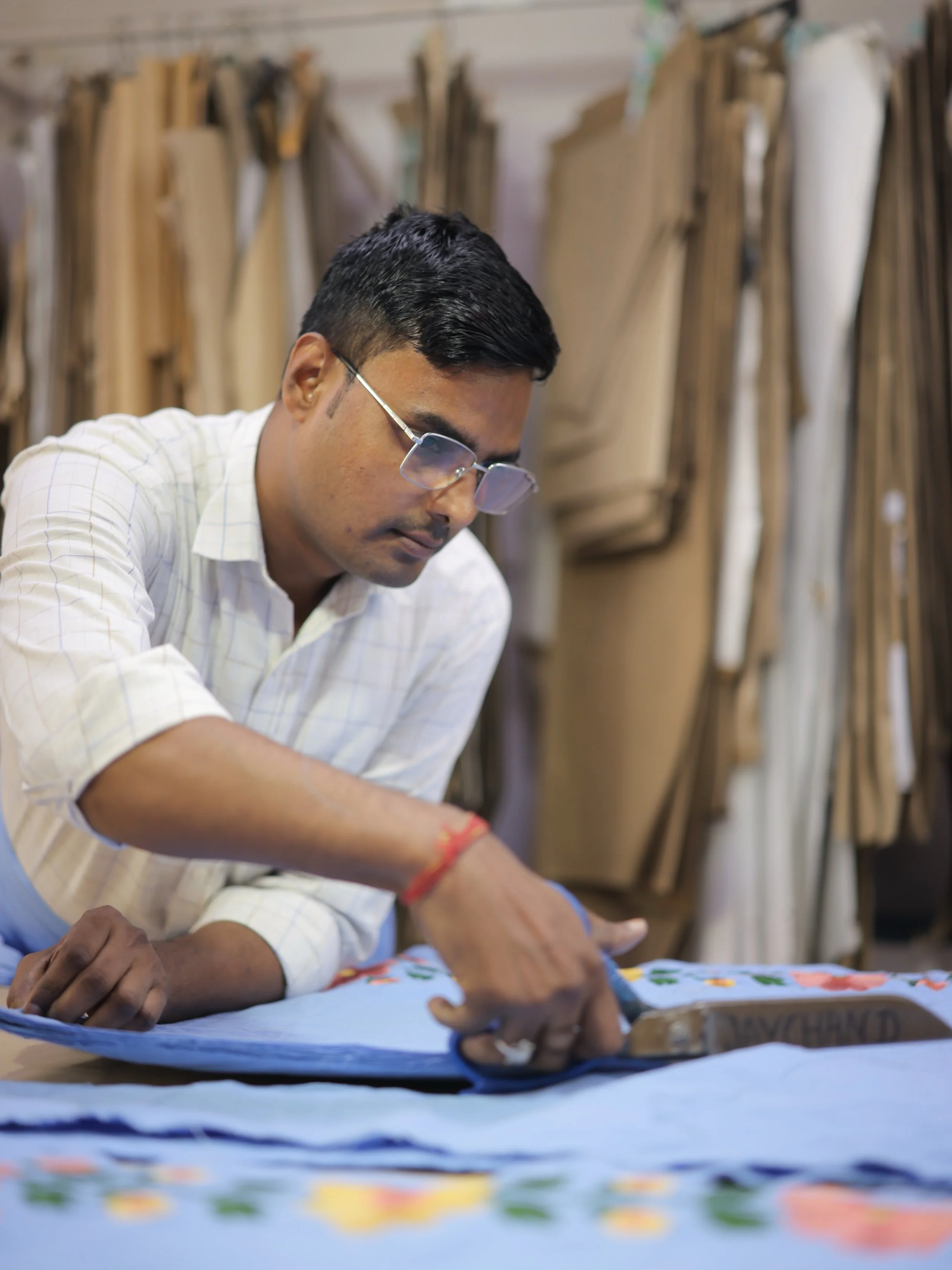 The art of cutting. 👌🏼 All garments are cut in house by our skilled Master Cutters. Our Master Cutters are well versed in all fabrics and ensure precision and accuracy in each cut.