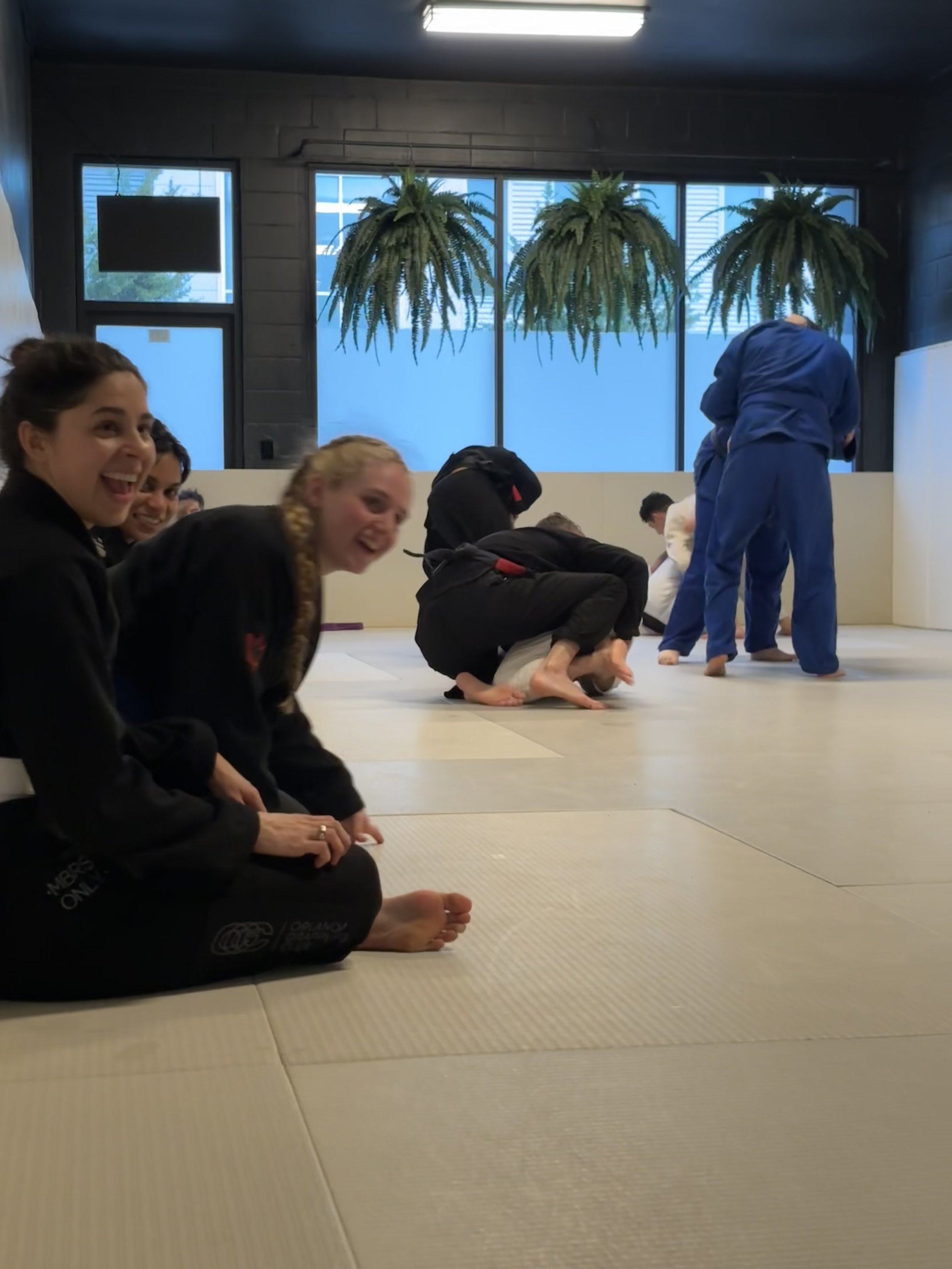 members laughing on the mat