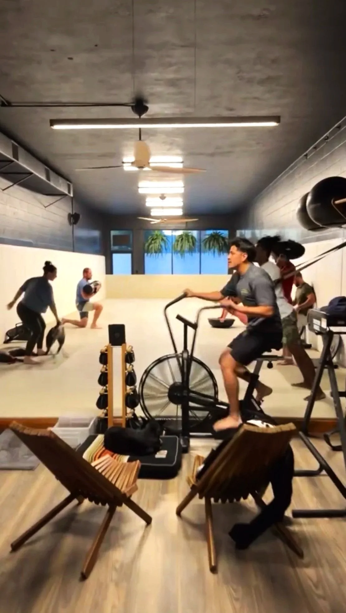 Group fitness class using functional fitness tools.