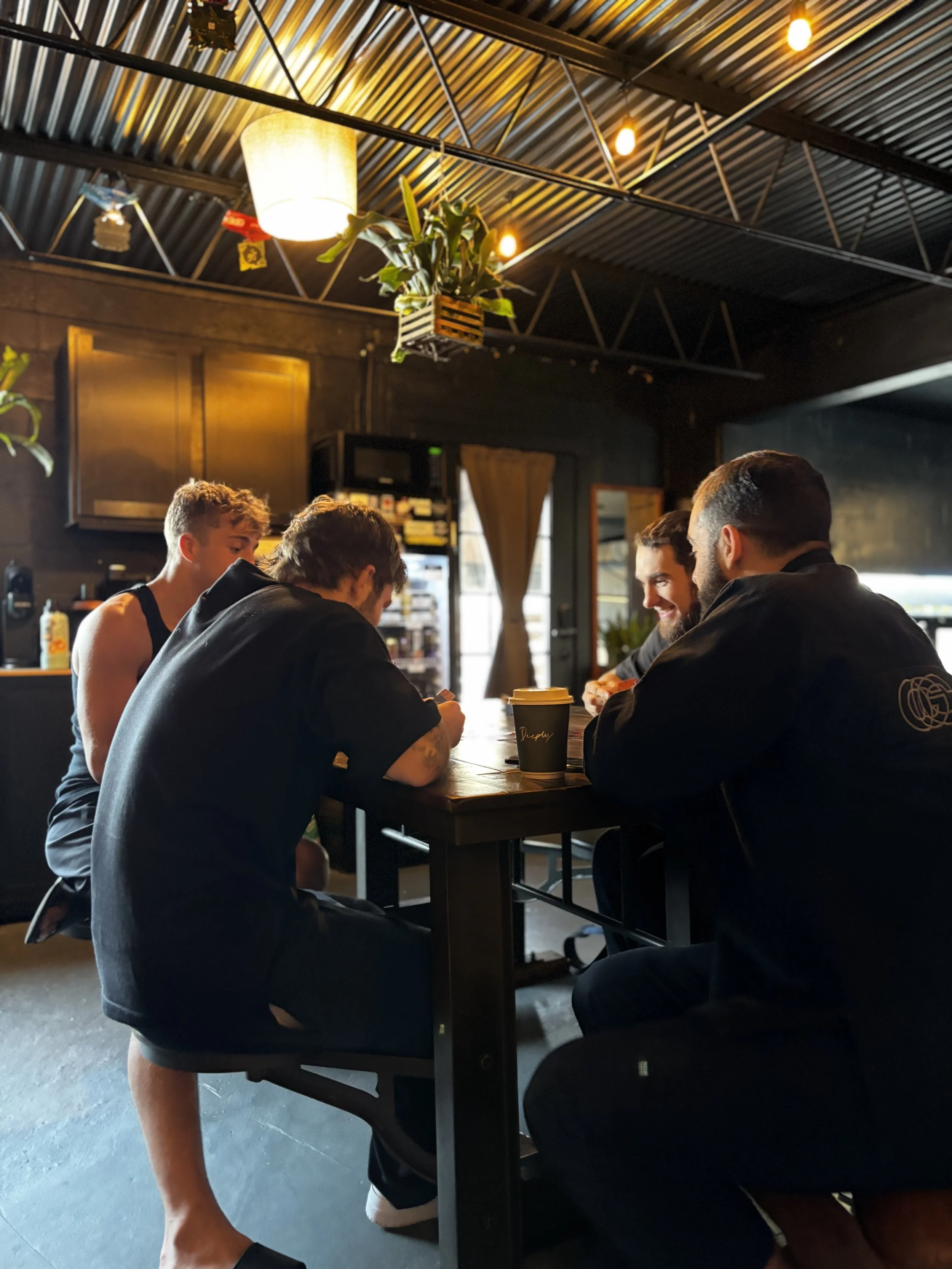 members chatting in the lounge before class